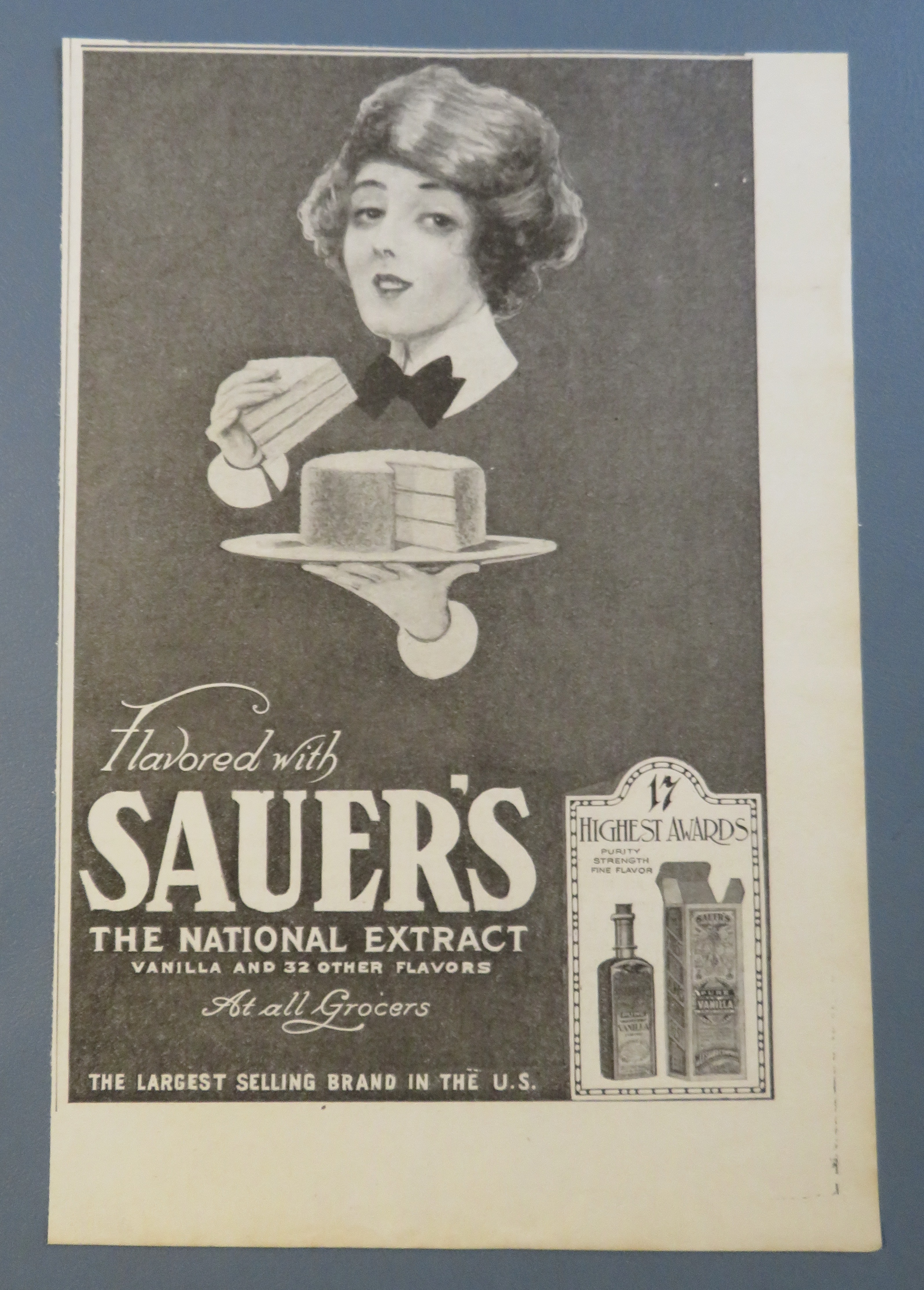1920 Sauer National Extract with Woman Eating Cake
