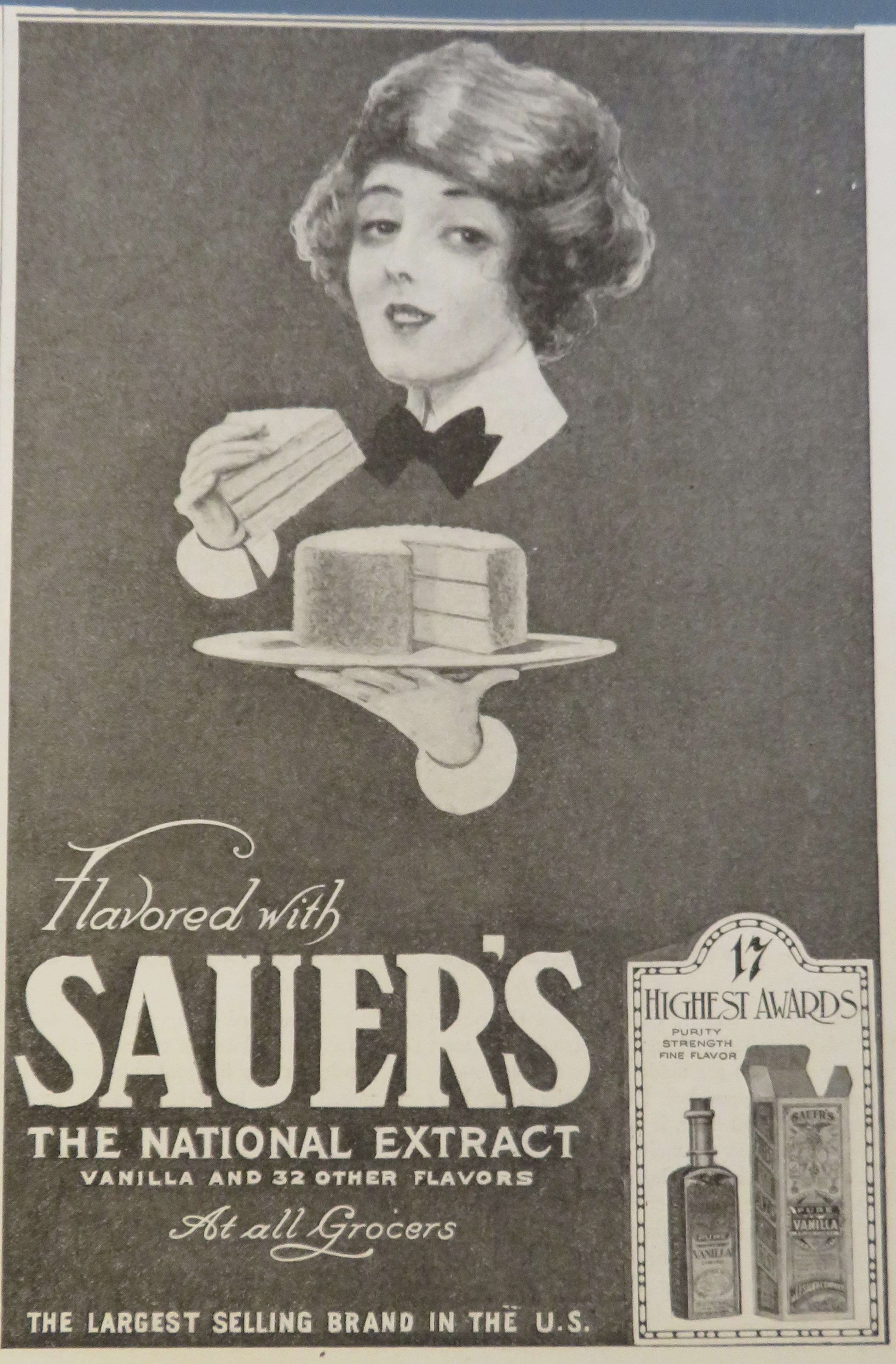 1920 Sauer National Extract with Woman Eating Cake