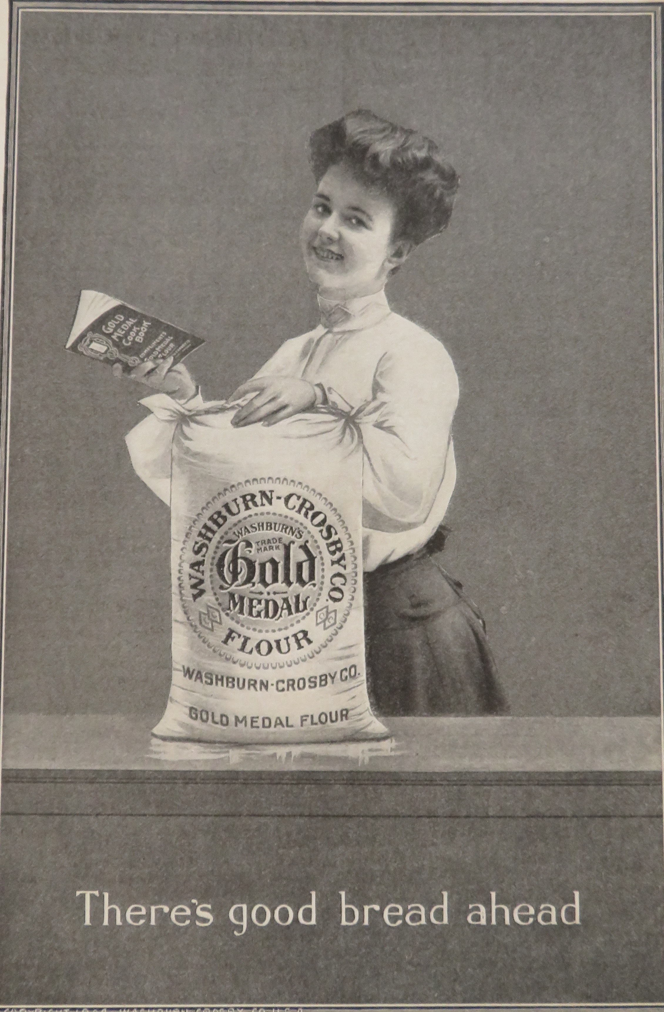 1904 Gold Medal Flour with Woman Holding Cook Book