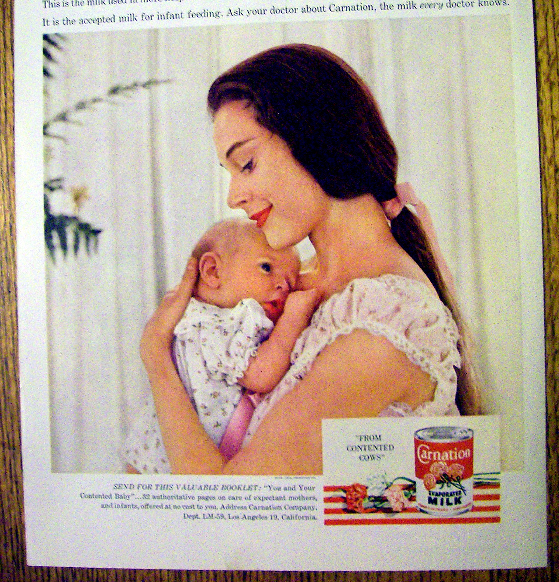 1959 Carnation Milk with Woman Holding Baby