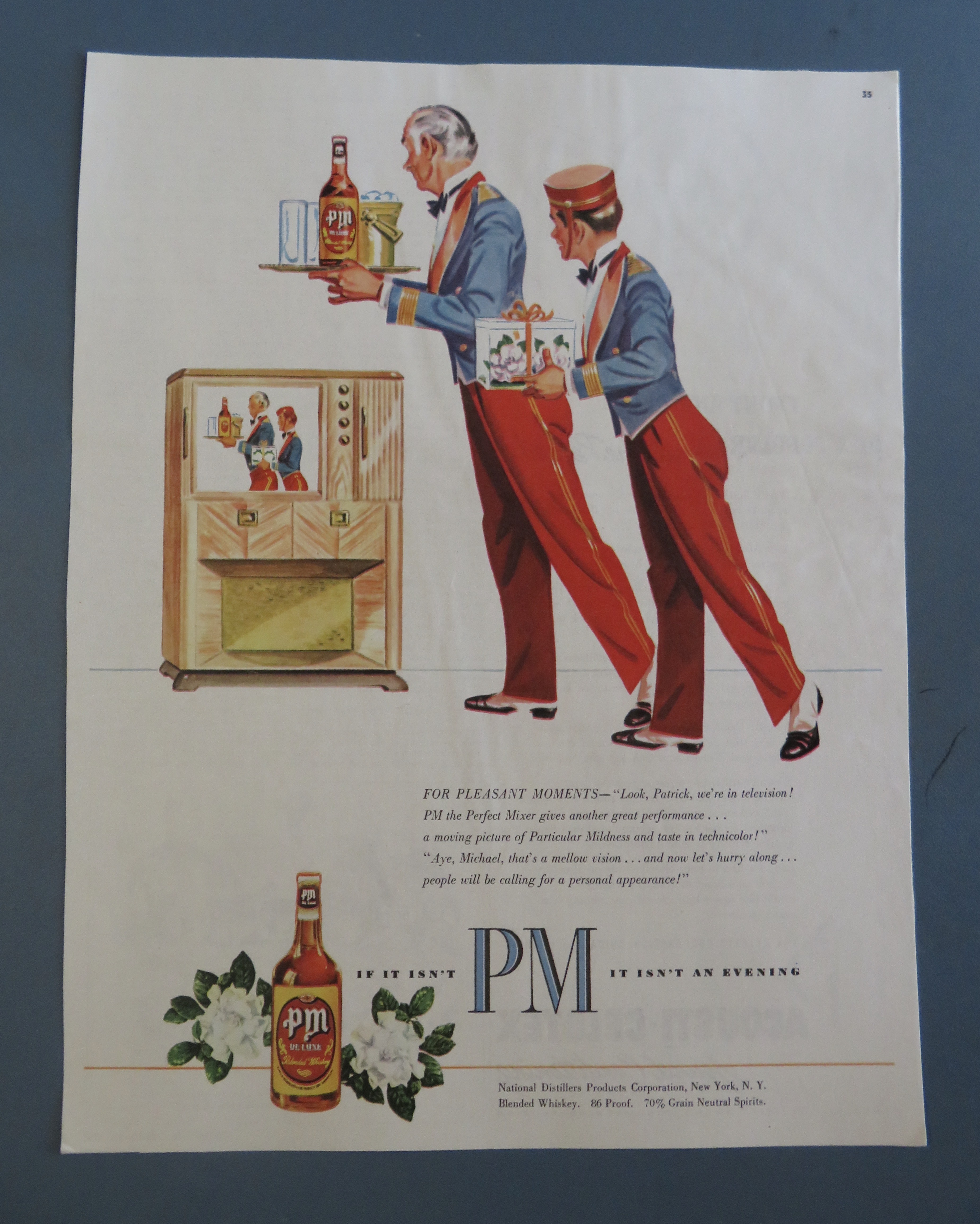 1950's PM Whiskey with 2 Bellboys Looking At A TV