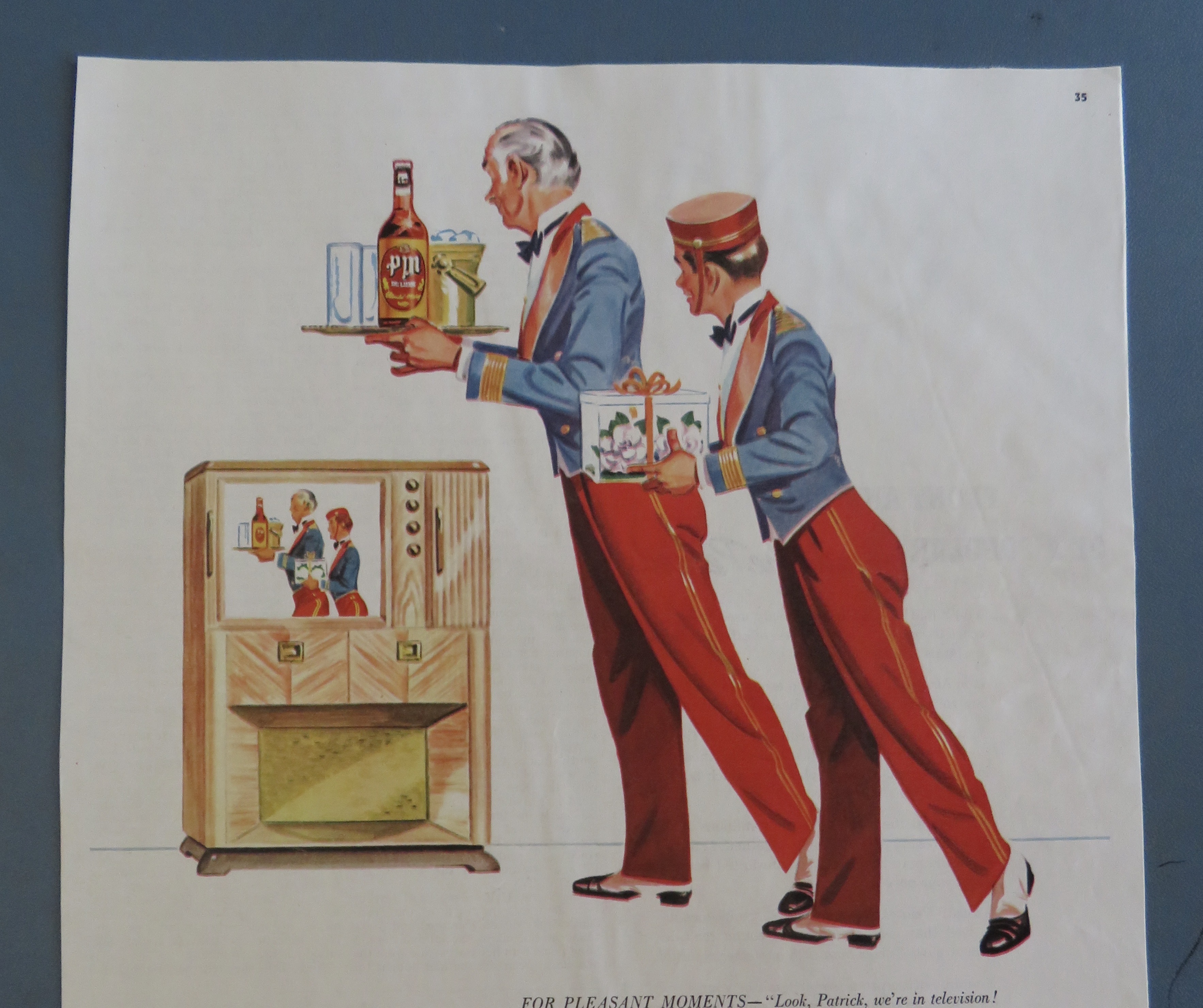 1950's PM Whiskey with 2 Bellboys Looking At A TV