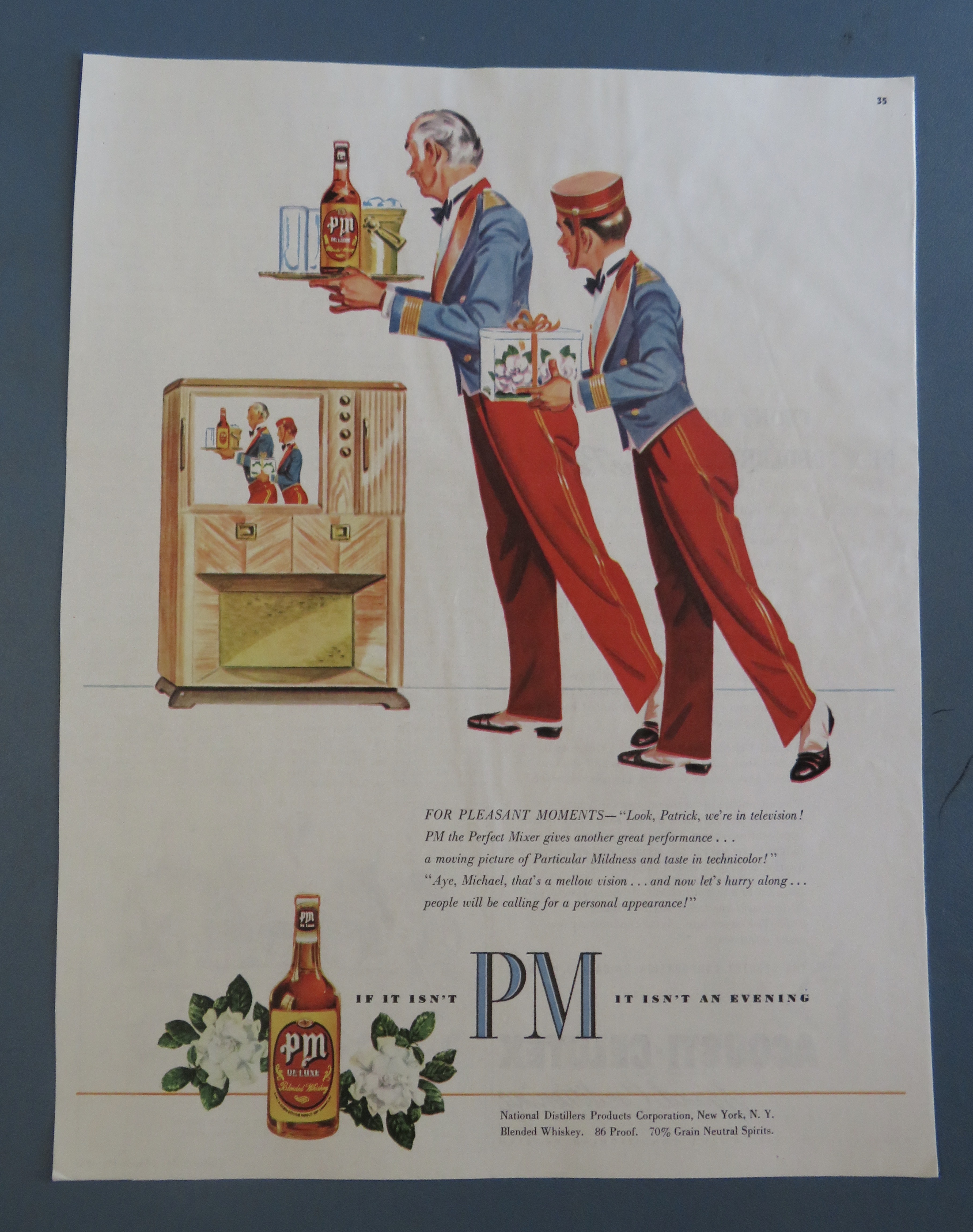 1950's PM Whiskey with 2 Bellboys Looking At A TV