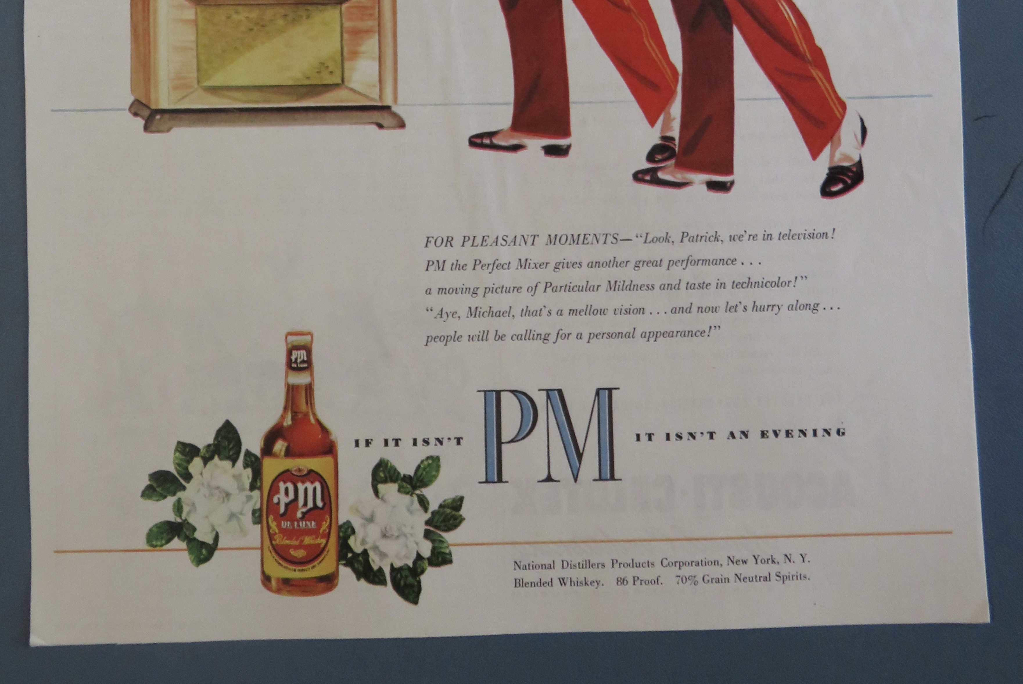 1950's PM Whiskey with 2 Bellboys Looking At A TV