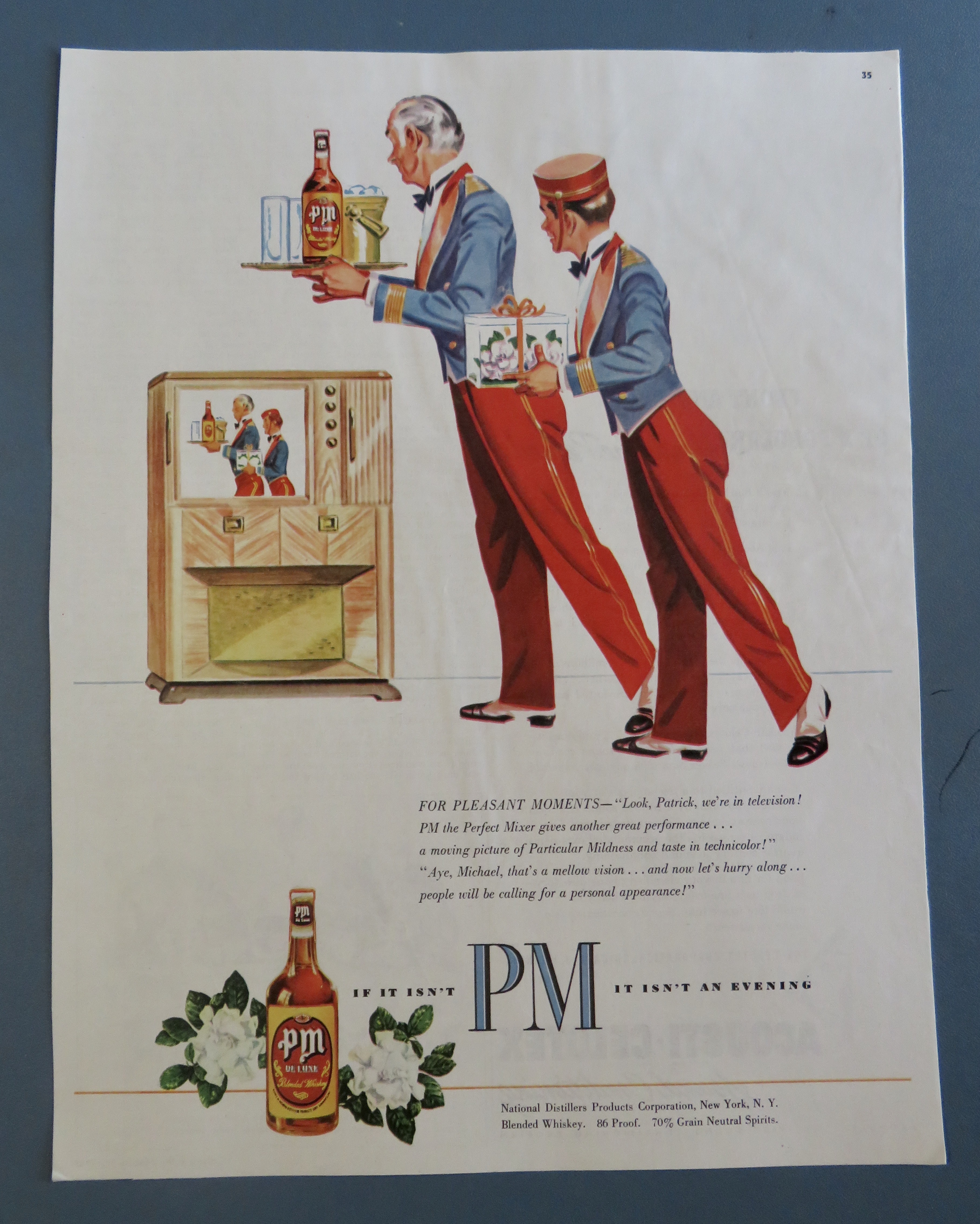 1950's PM Whiskey with 2 Bellboys Looking At A TV