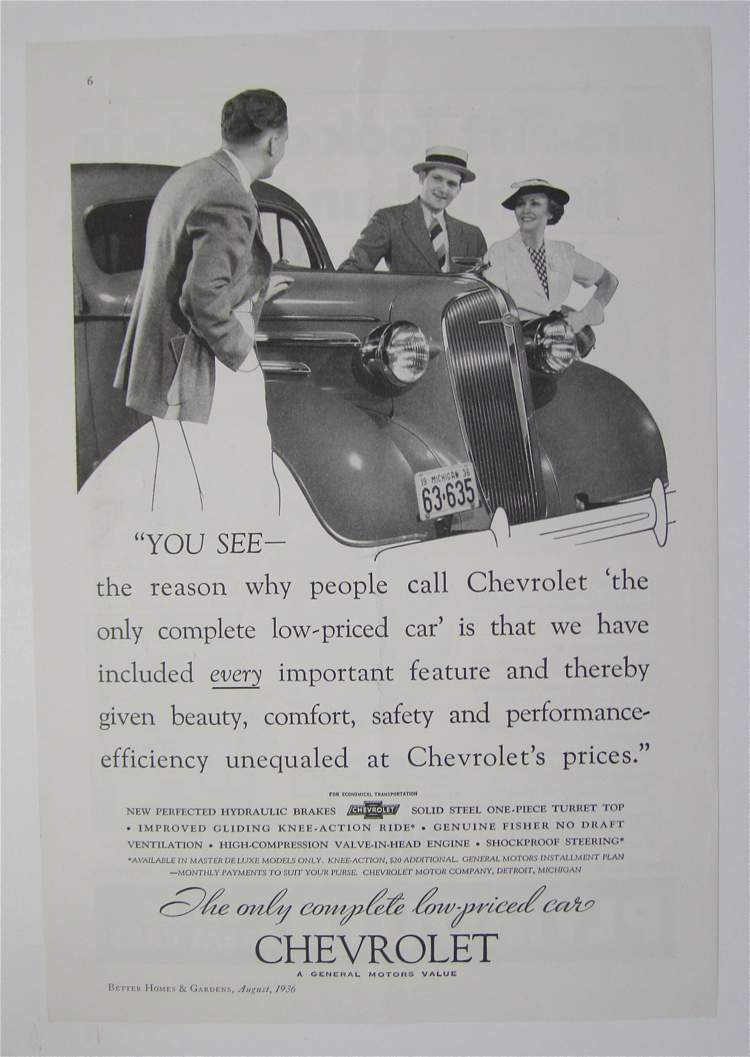 1936 Chevrolet with Man Talking with a Couple