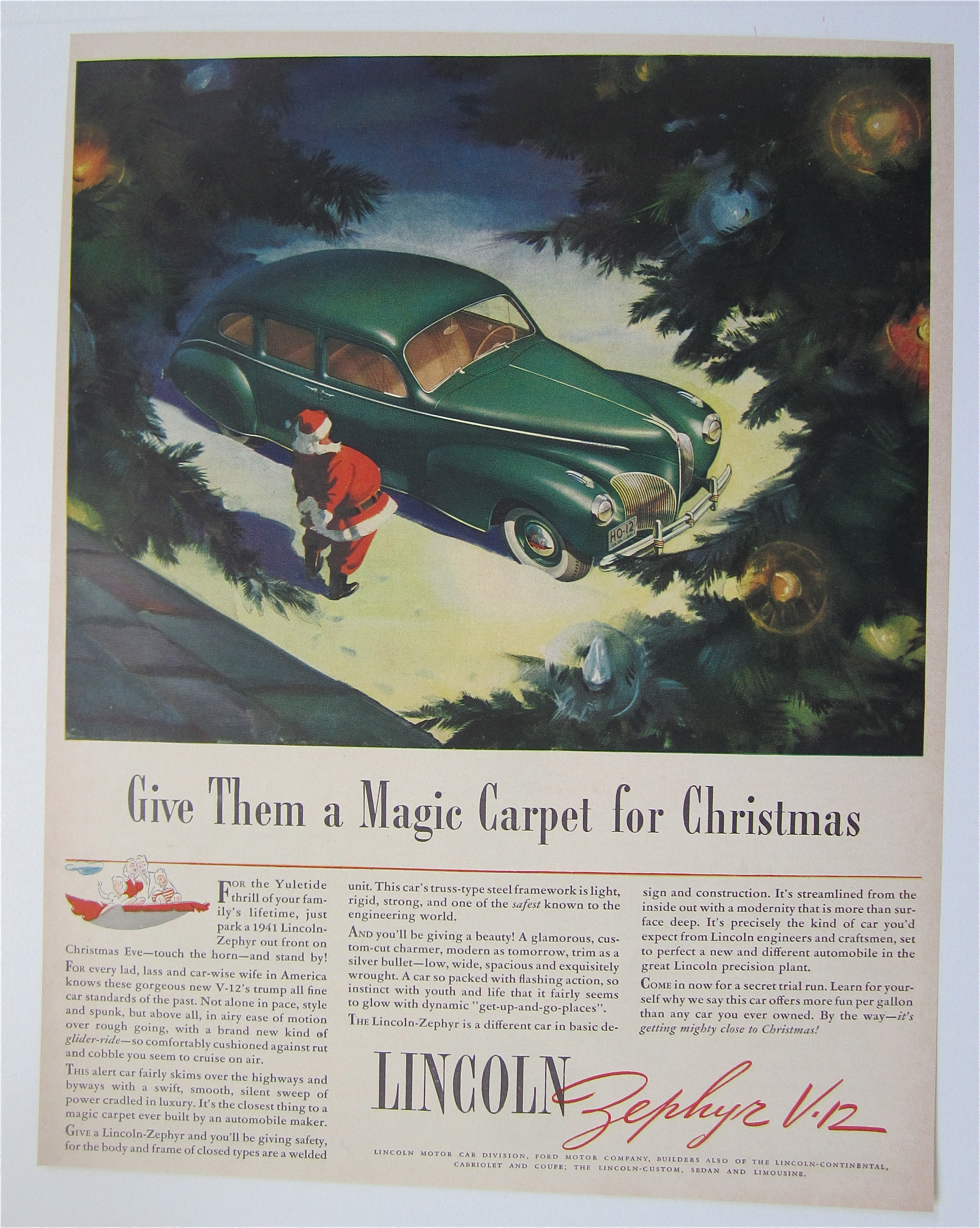 1940 Lincoln Zephyr V-12 with Santa Looking At Car