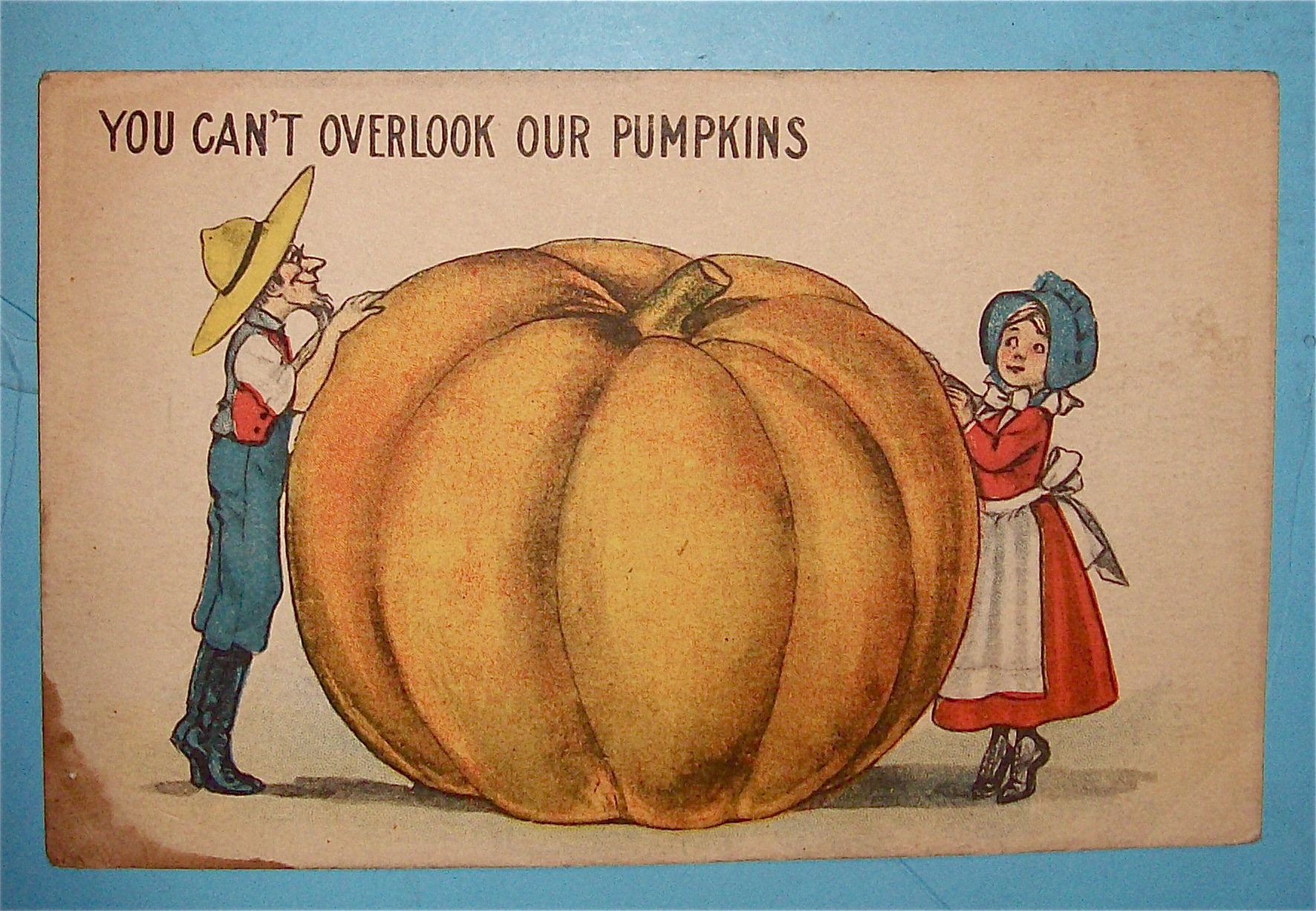 Big Pumpkin Between Man & Woman Postcard