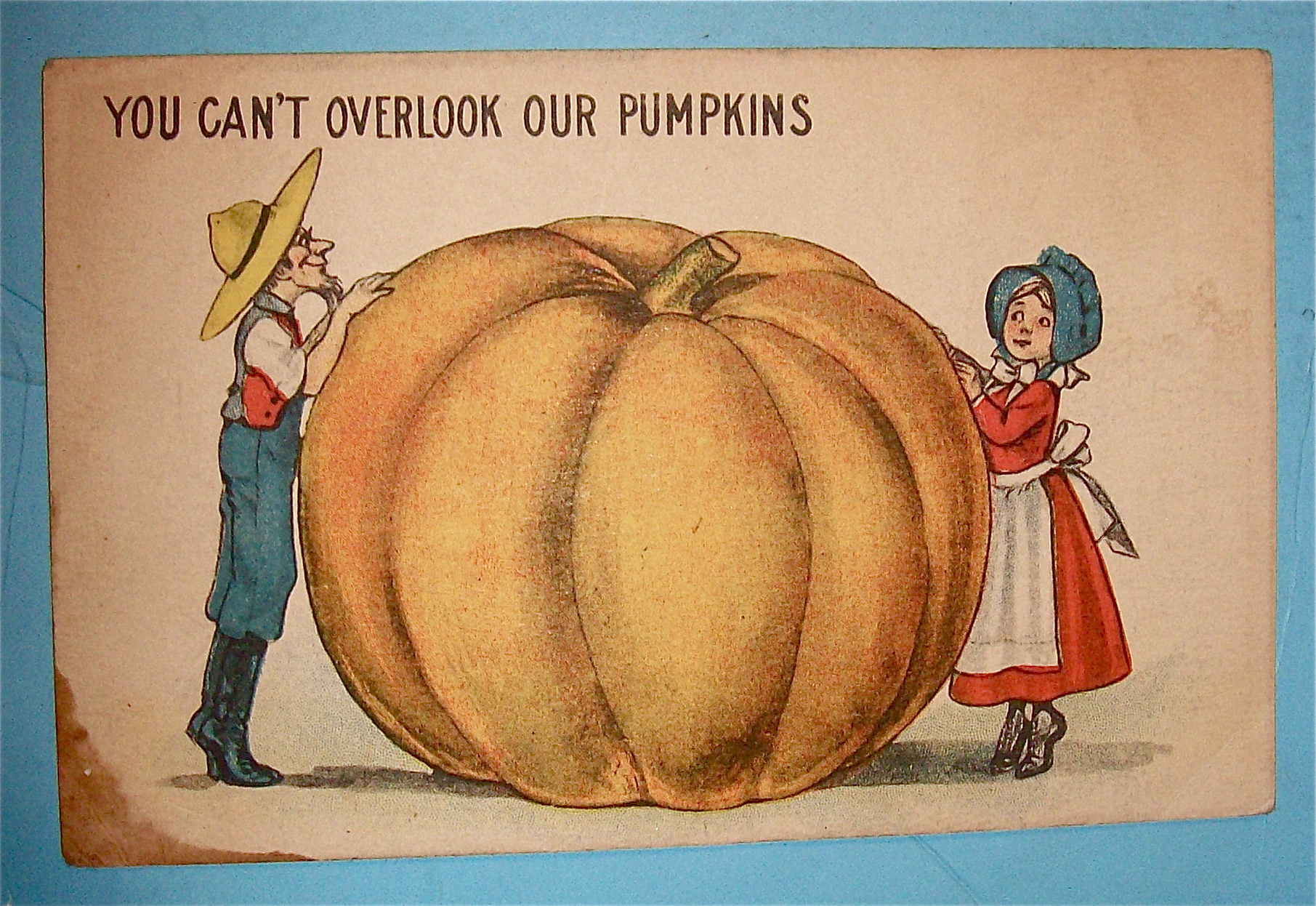 Big Pumpkin Between Man & Woman Postcard