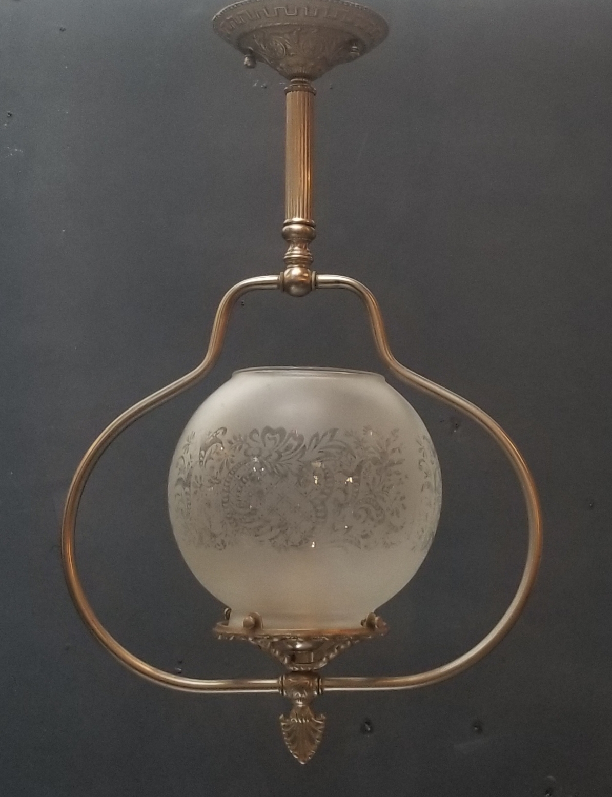 Single globe light fixture with antique glass