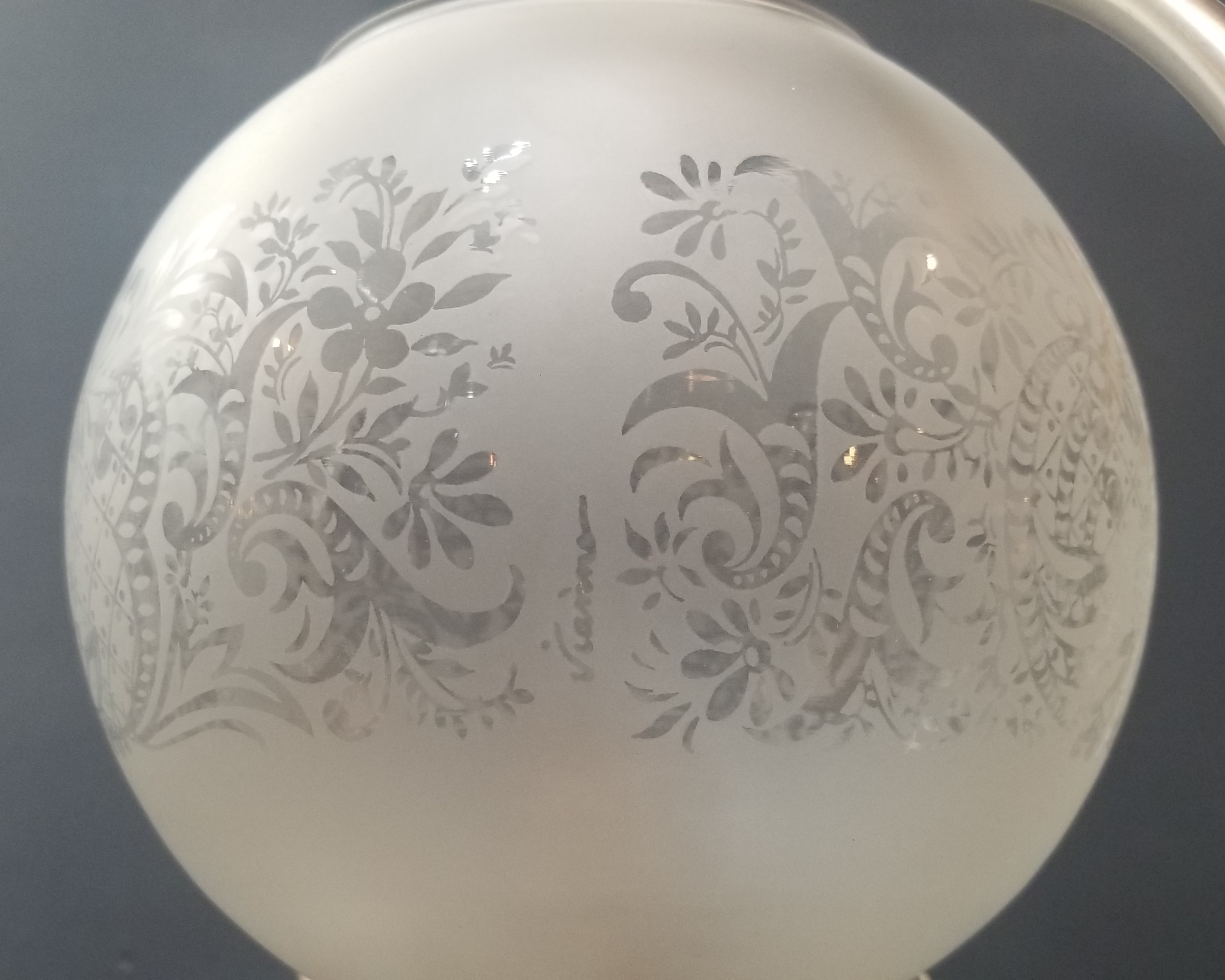 Single globe light fixture with antique glass