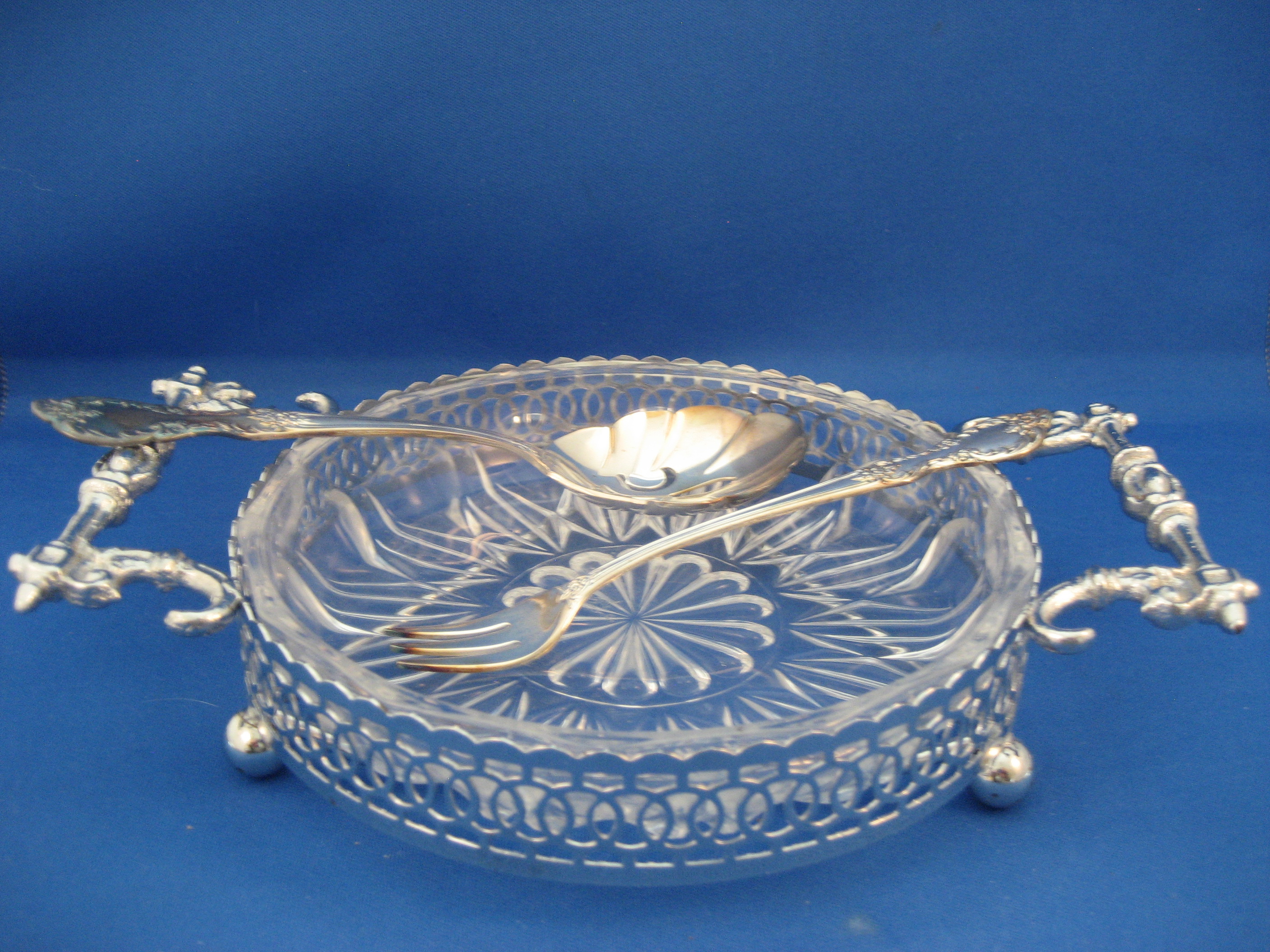 Glass and Silver Dish with Fork and Spoon