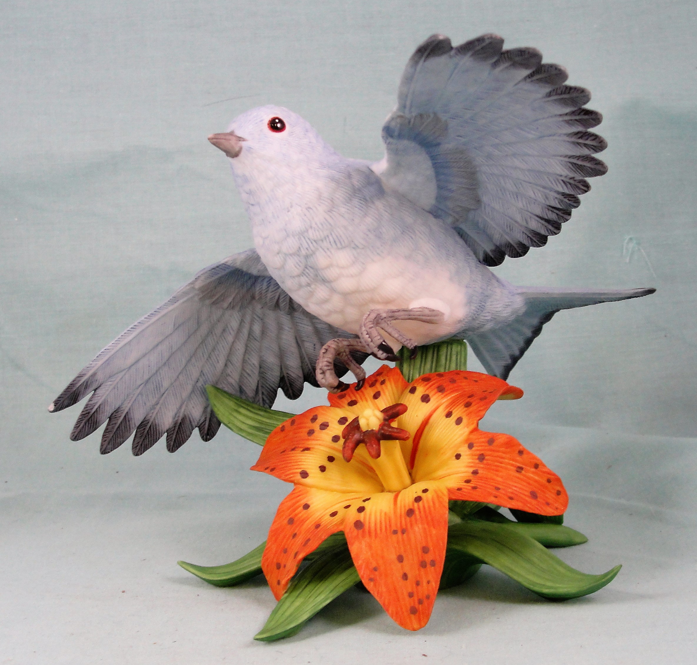 Lenox Mountain Bluebird in Flight Over a Lily