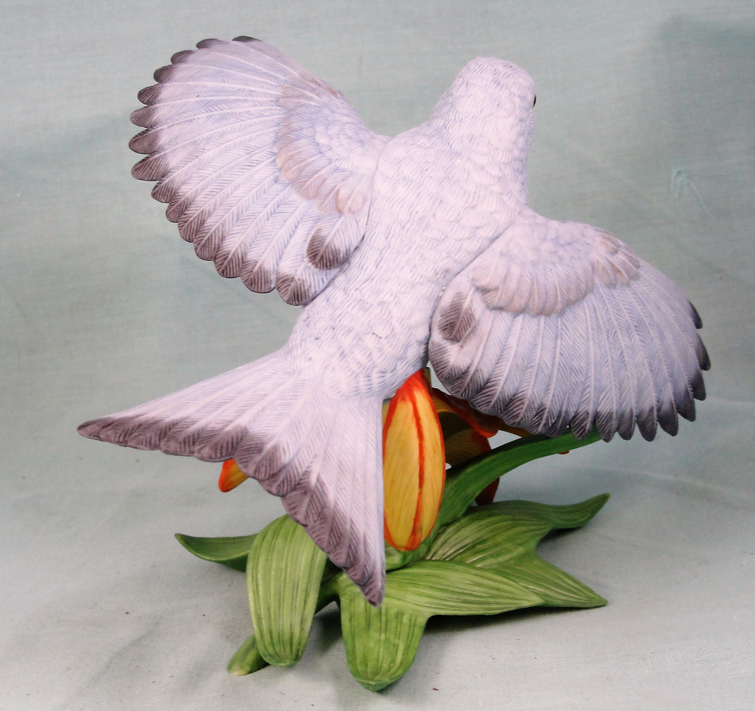 Lenox Mountain Bluebird in Flight Over a Lily