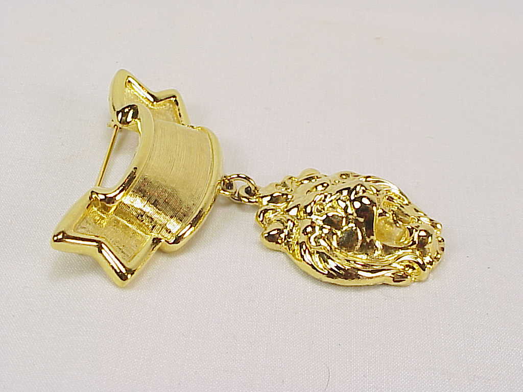 Dangling Lion Head Gold Tone Banner Brooch