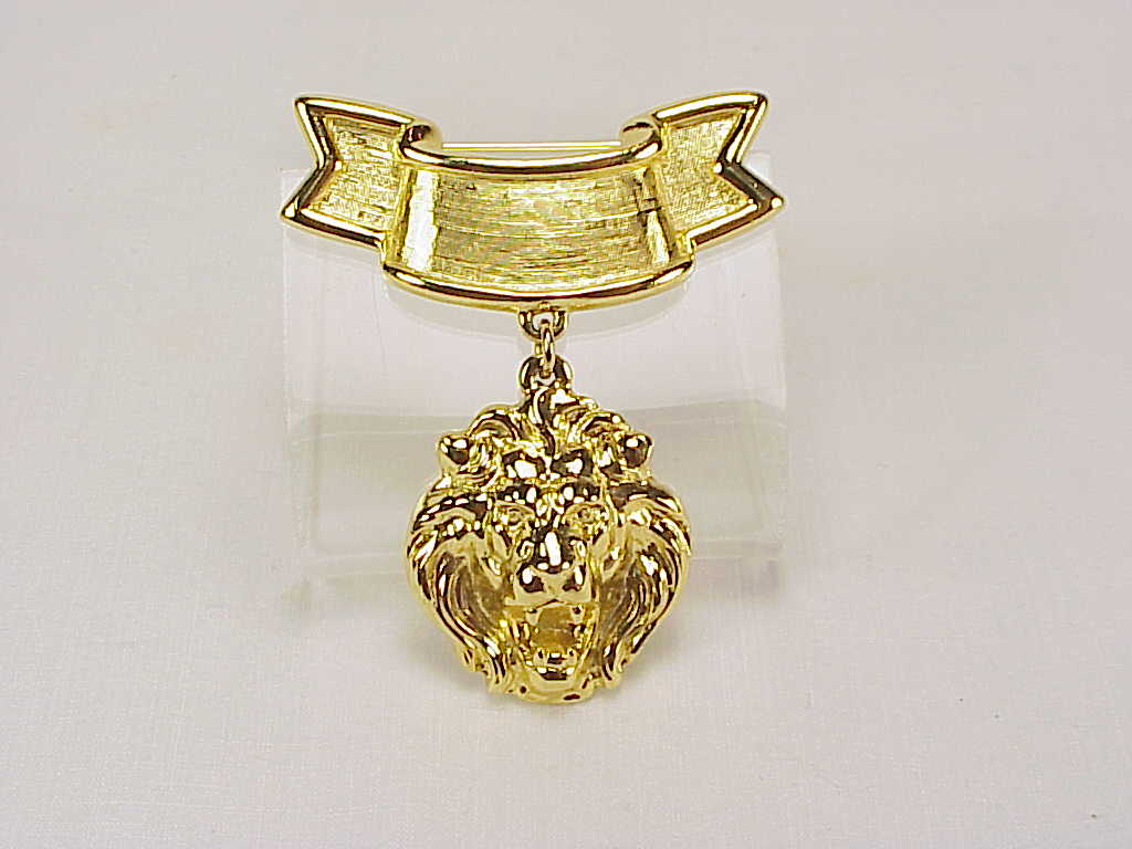 Dangling Lion Head Gold Tone Banner Brooch
