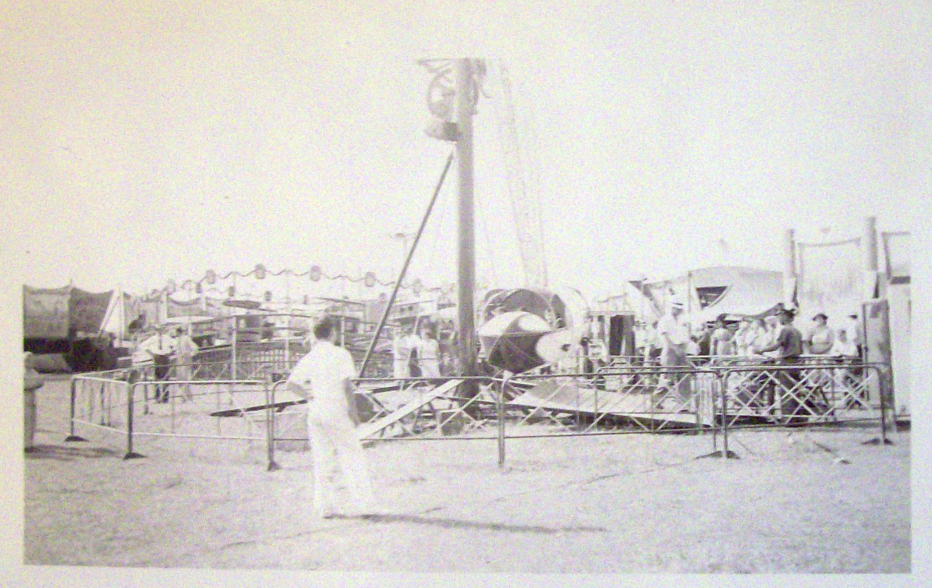 Photograph Of Carnival Scene with a Variety of Rides