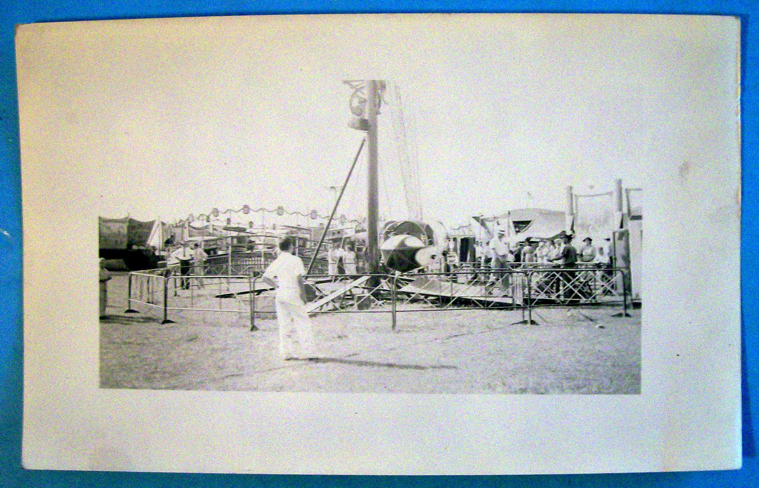 Photograph Of Carnival Scene with a Variety of Rides