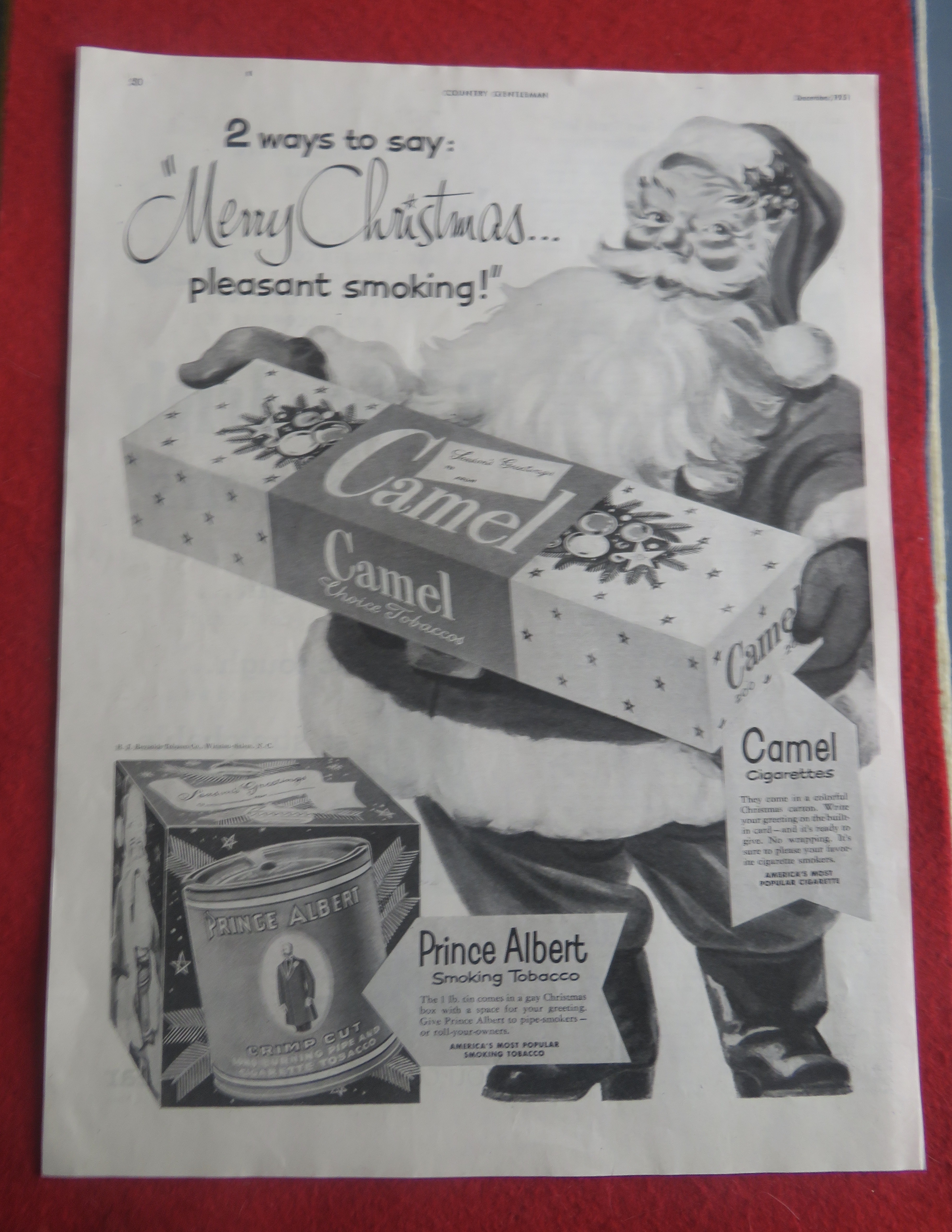1951 Camel Cigarettes with Santa Claus Holding A Carton