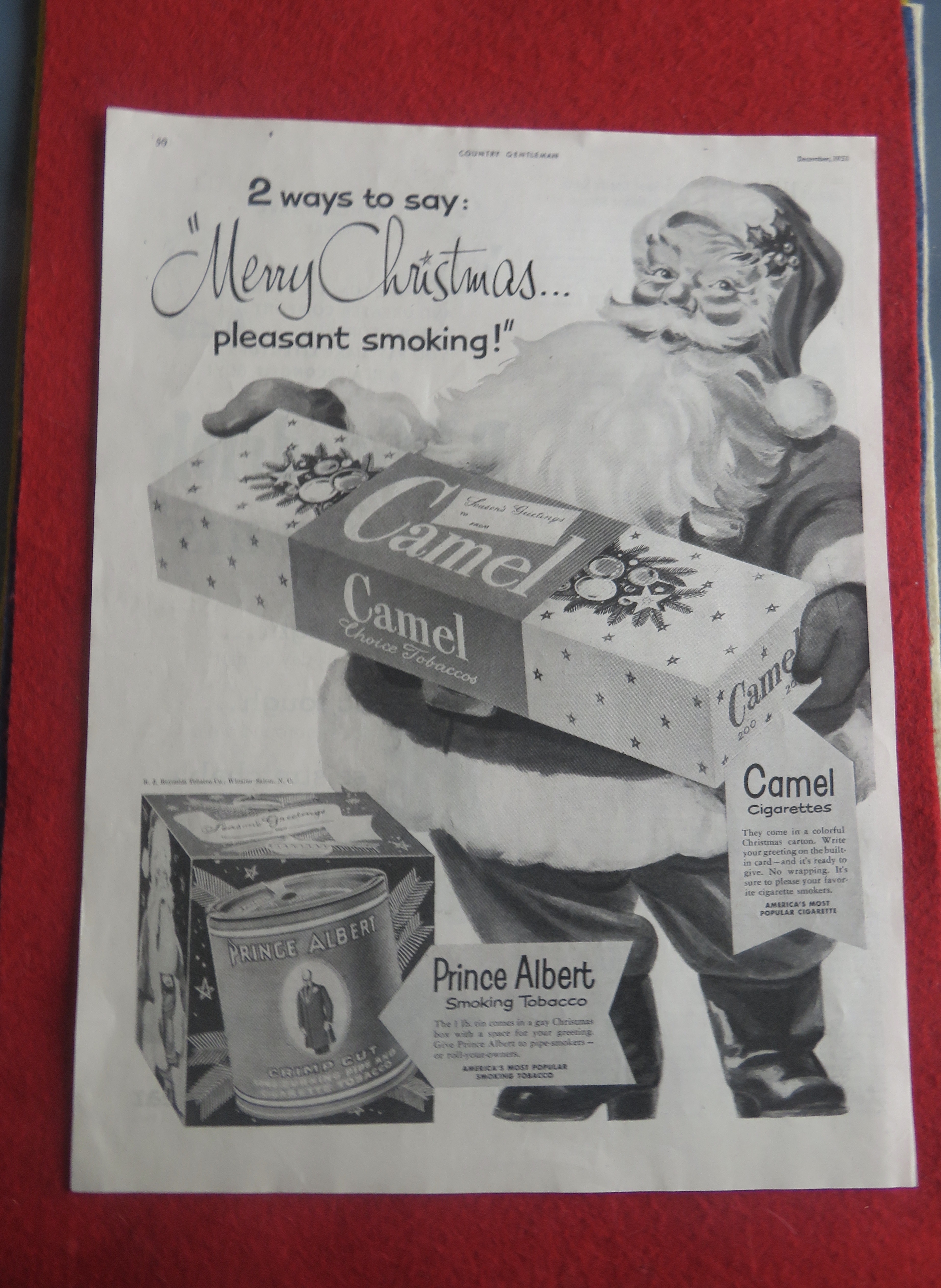 1951 Camel Cigarettes with Santa Claus Holding A Carton
