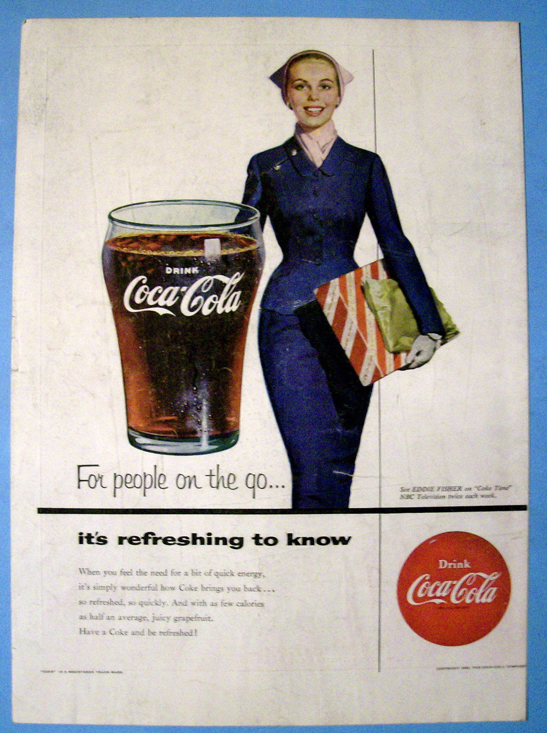 1954 Coca Cola (Coke) with a Woman Carrying a Gift Box