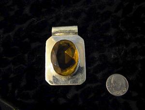 Sterling Silver and Citrine Oblong Pendant.