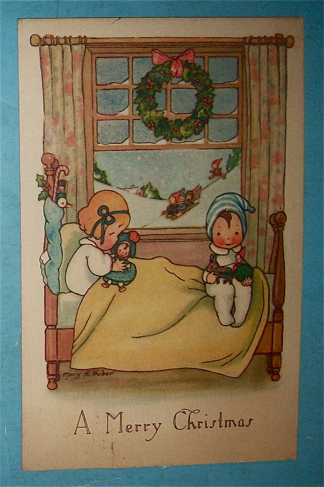 A Merry Christmas Postcard w/Two Children on Bed