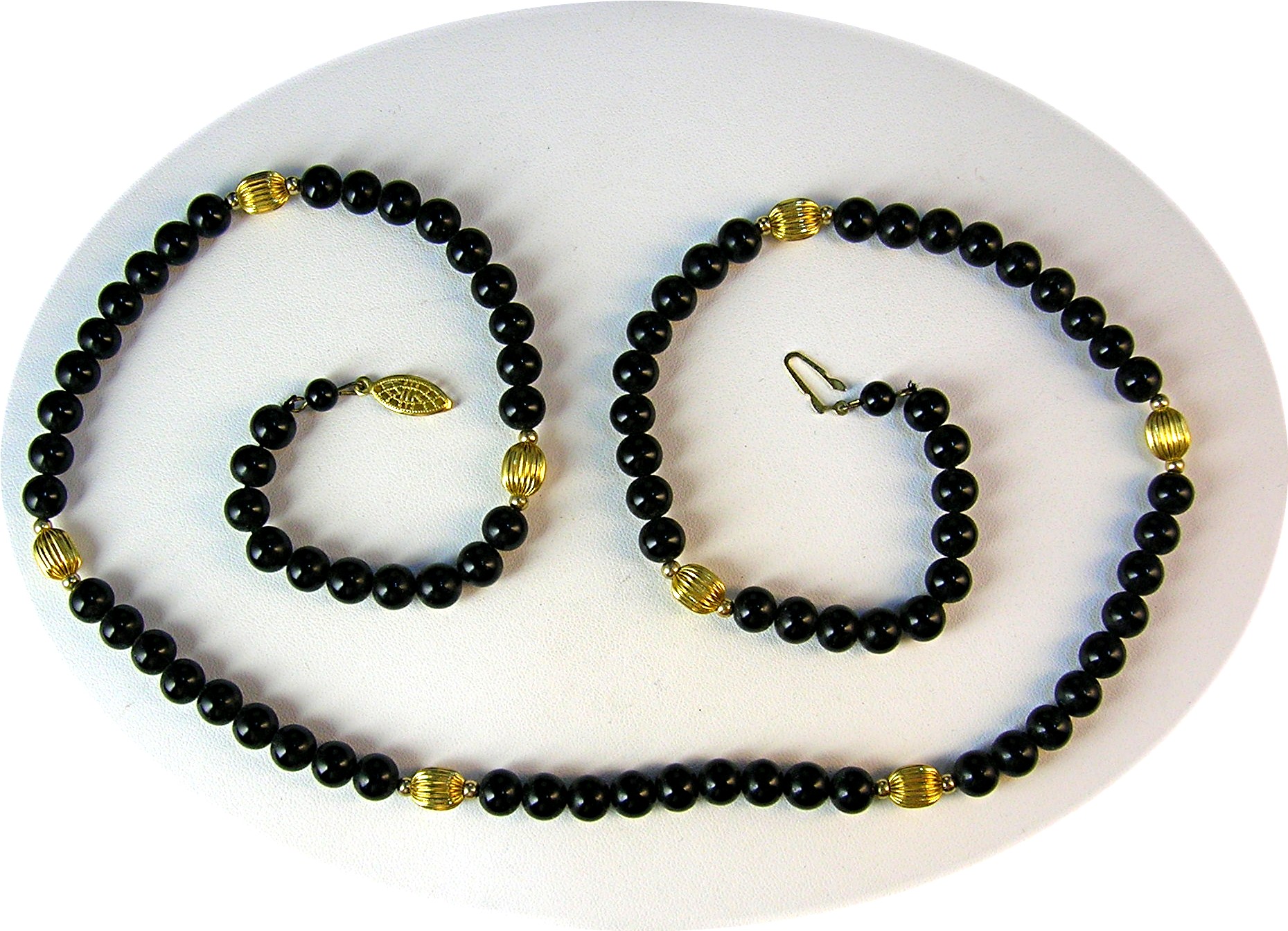 28 Inch Necklace of 7mm Black Onyx/Gold Beads