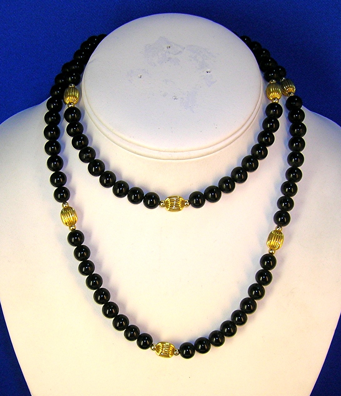 28 Inch Necklace of 7mm Black Onyx/Gold Beads
