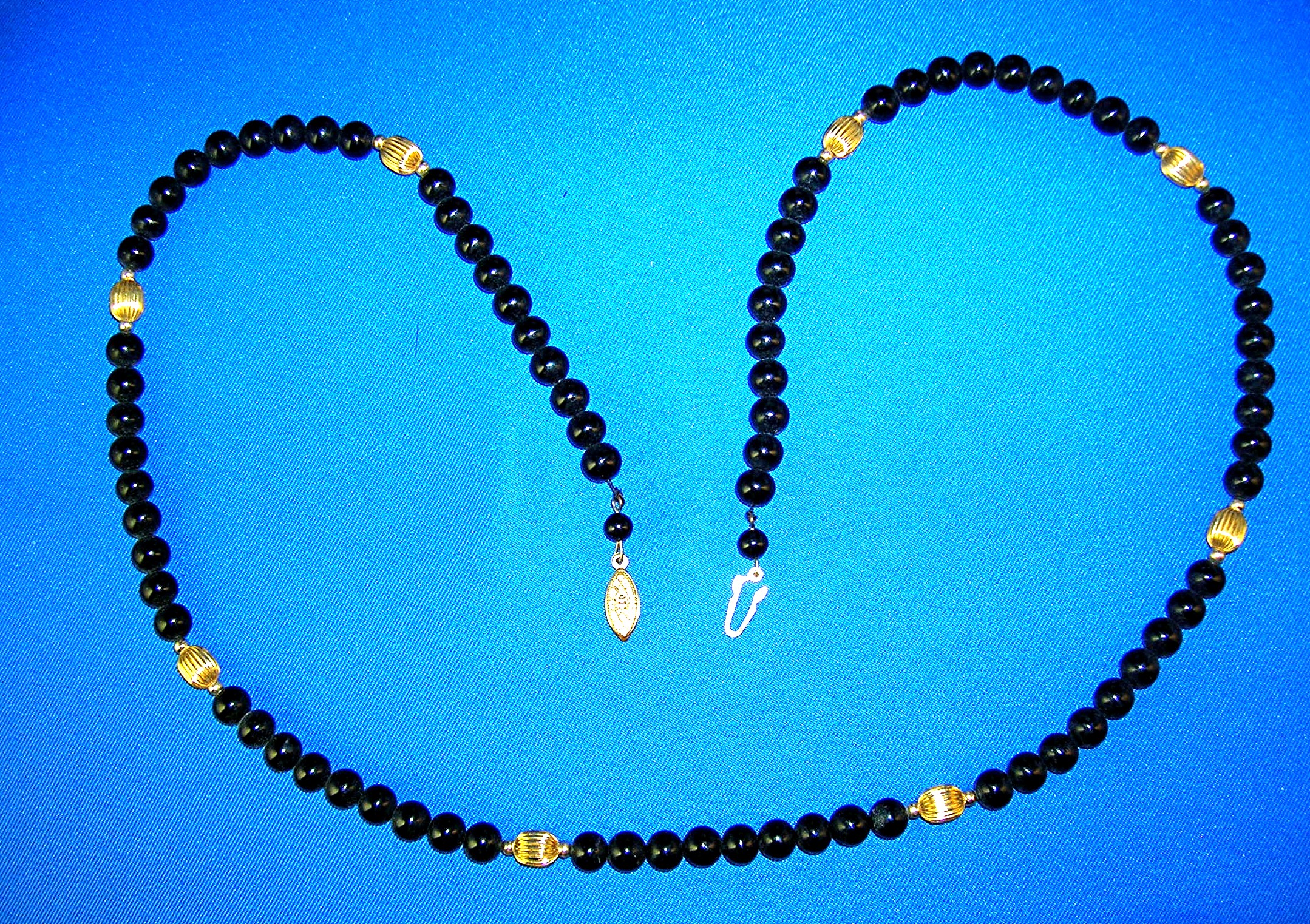 28 Inch Necklace of 7mm Black Onyx/Gold Beads