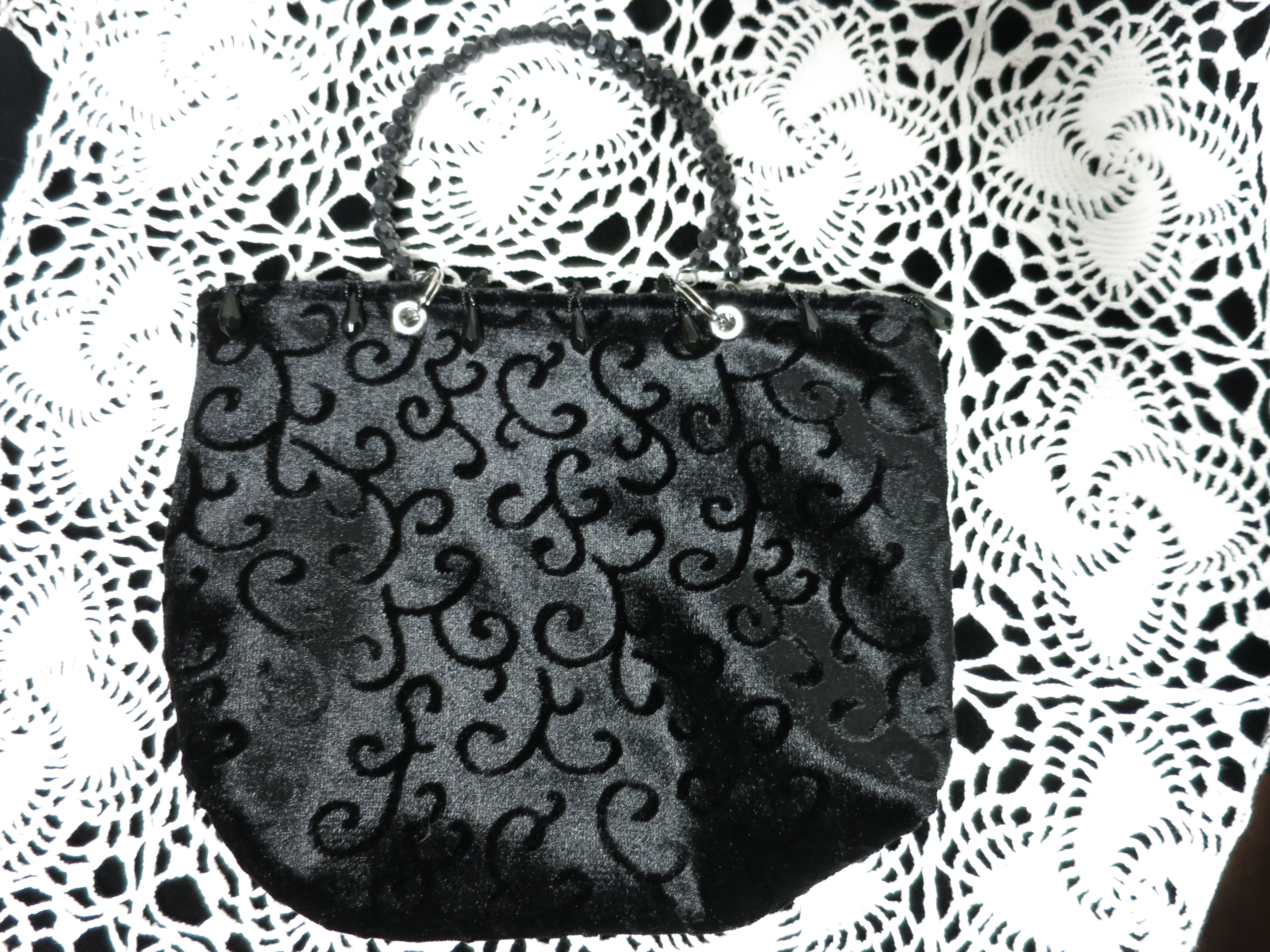Black Handbag with Beaded handles and Tassel Trim