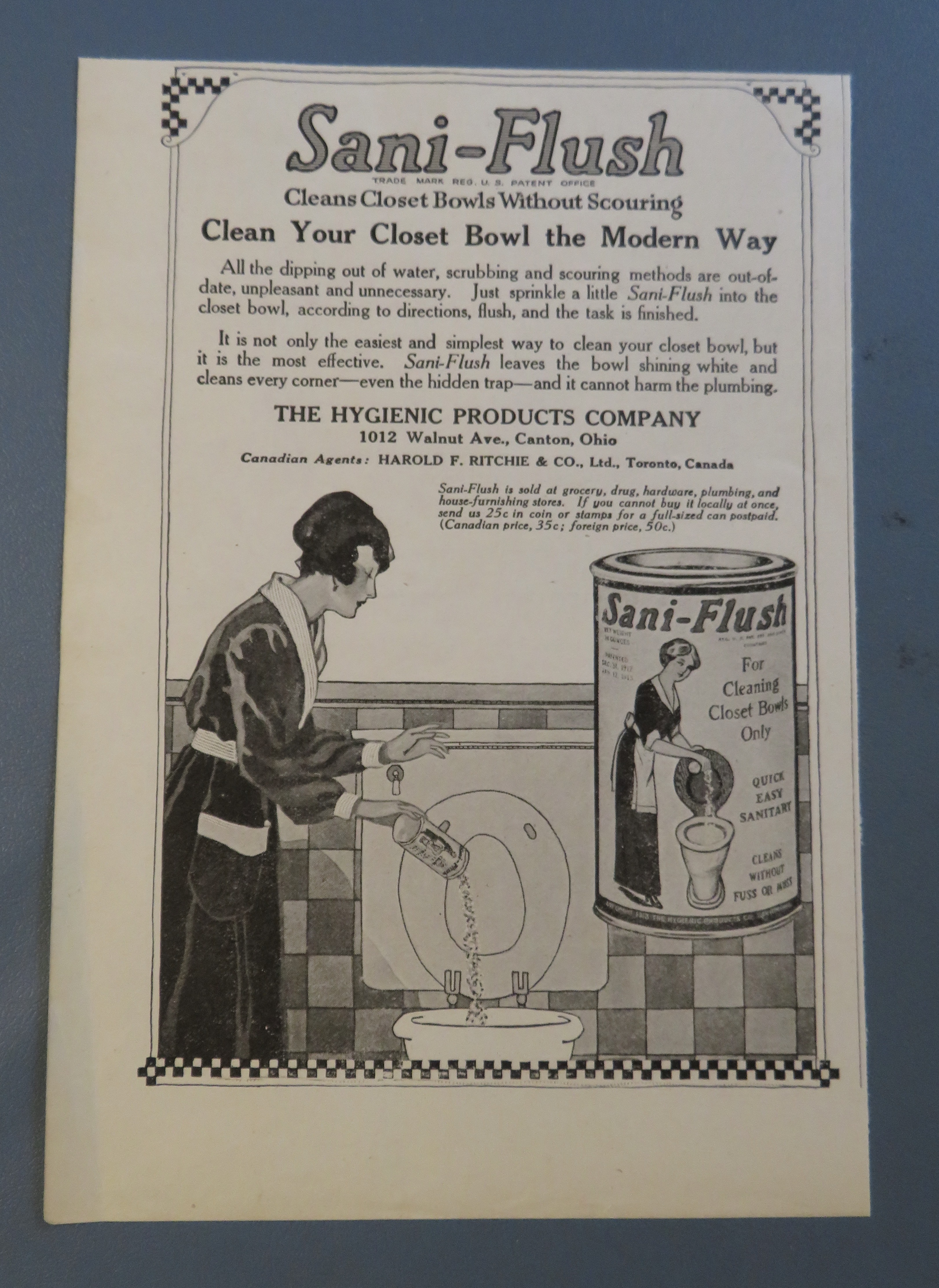 1920 Sani Flush with Woman Cleaning Toilet
