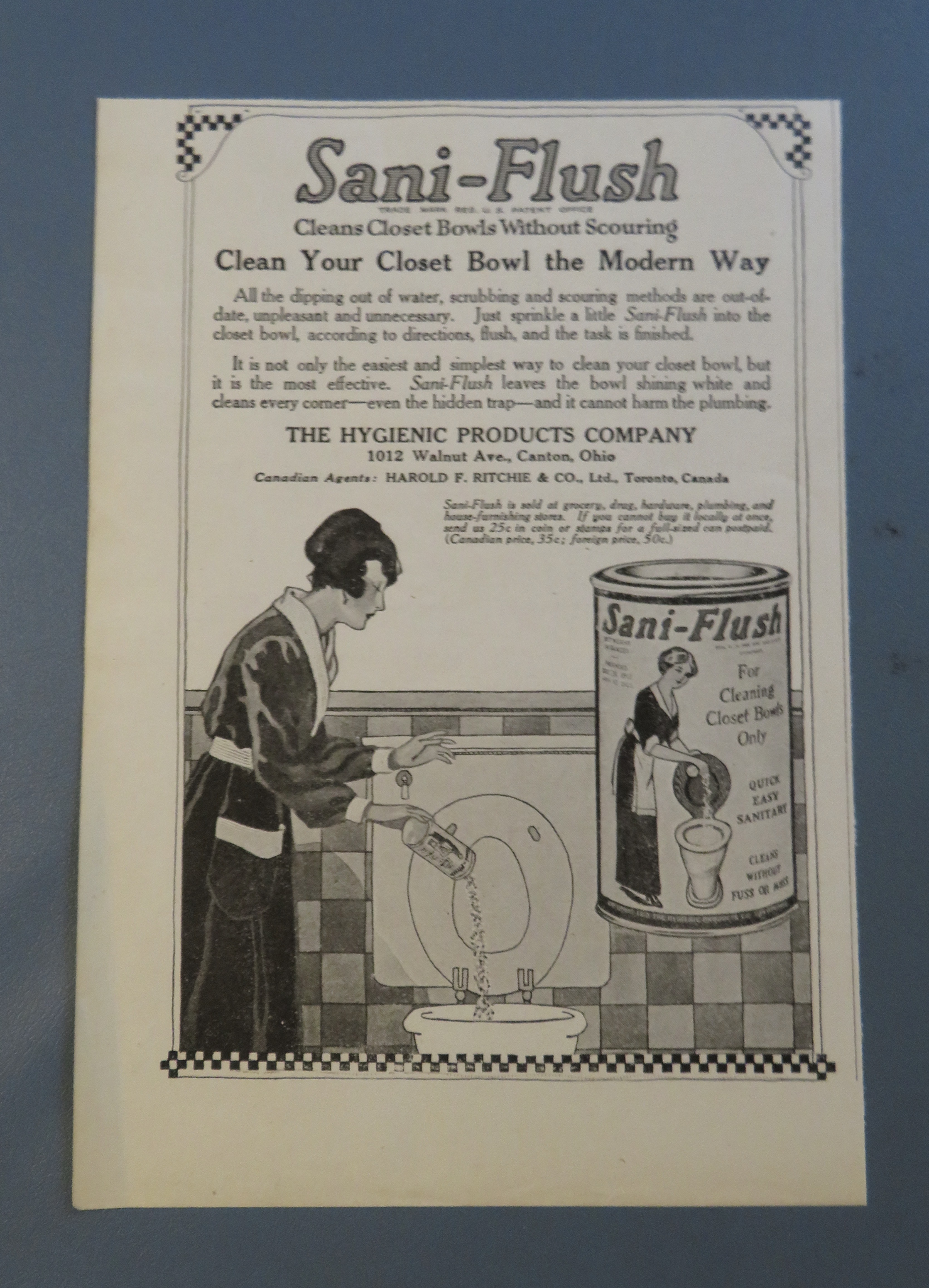 1920 Sani Flush with Woman Cleaning Toilet