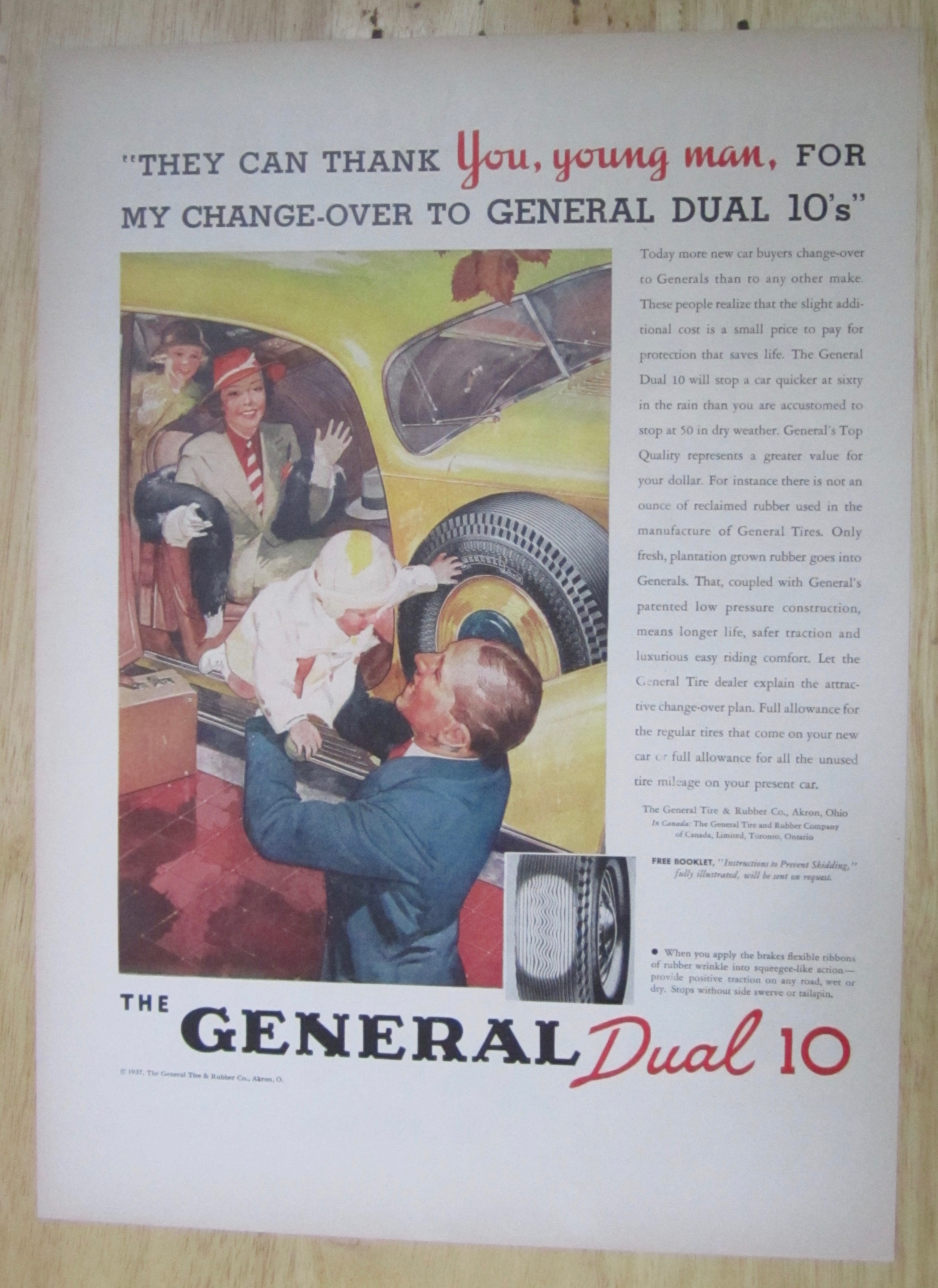 1937 General Dual 10 Tire with Man Holding A Baby