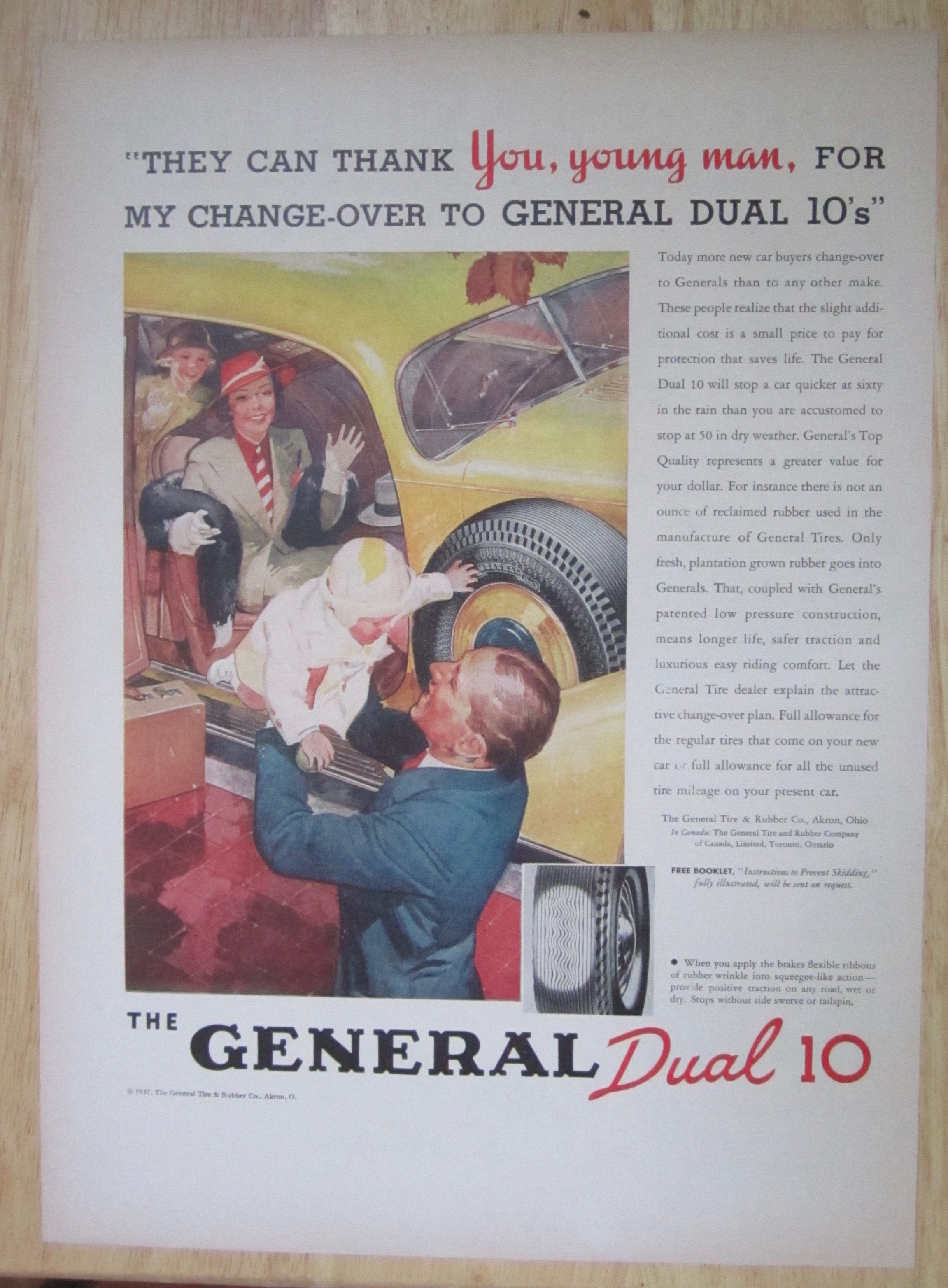 1937 General Dual 10 Tire with Man Holding A Baby
