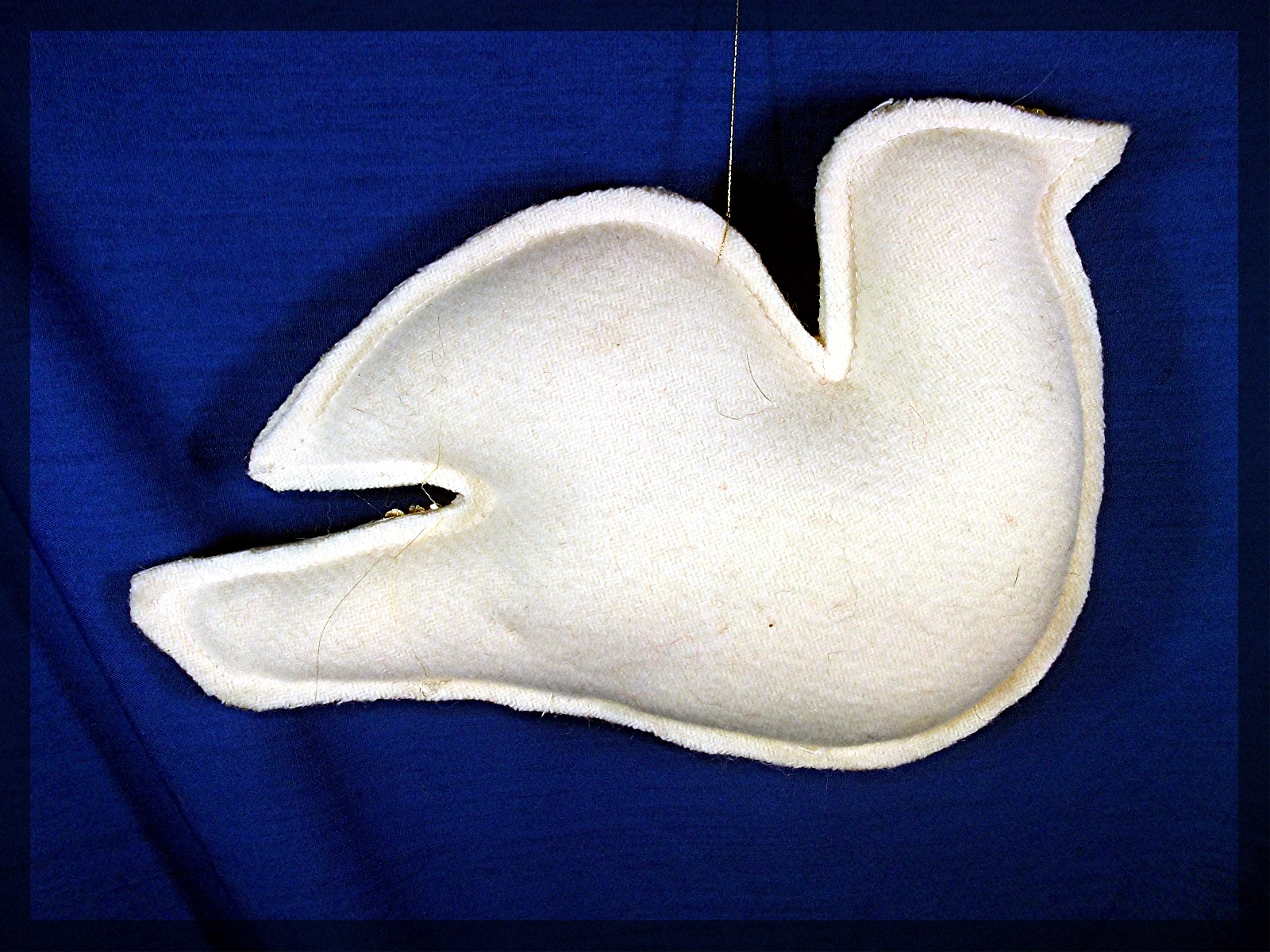 Handmade white dove decoration with red heart