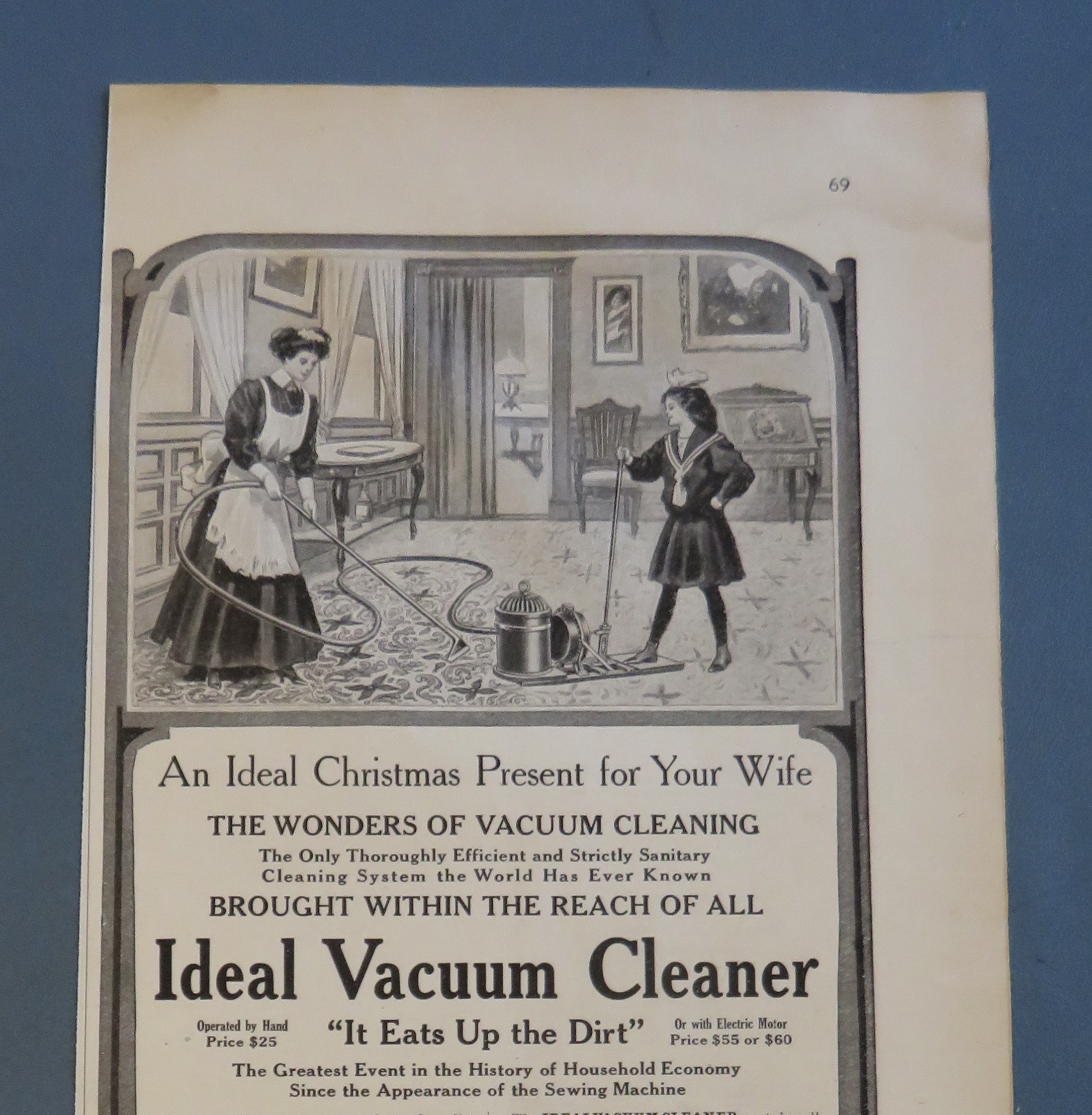 1908 Ideal Vacuum Cleaner with Woman Vacuuming