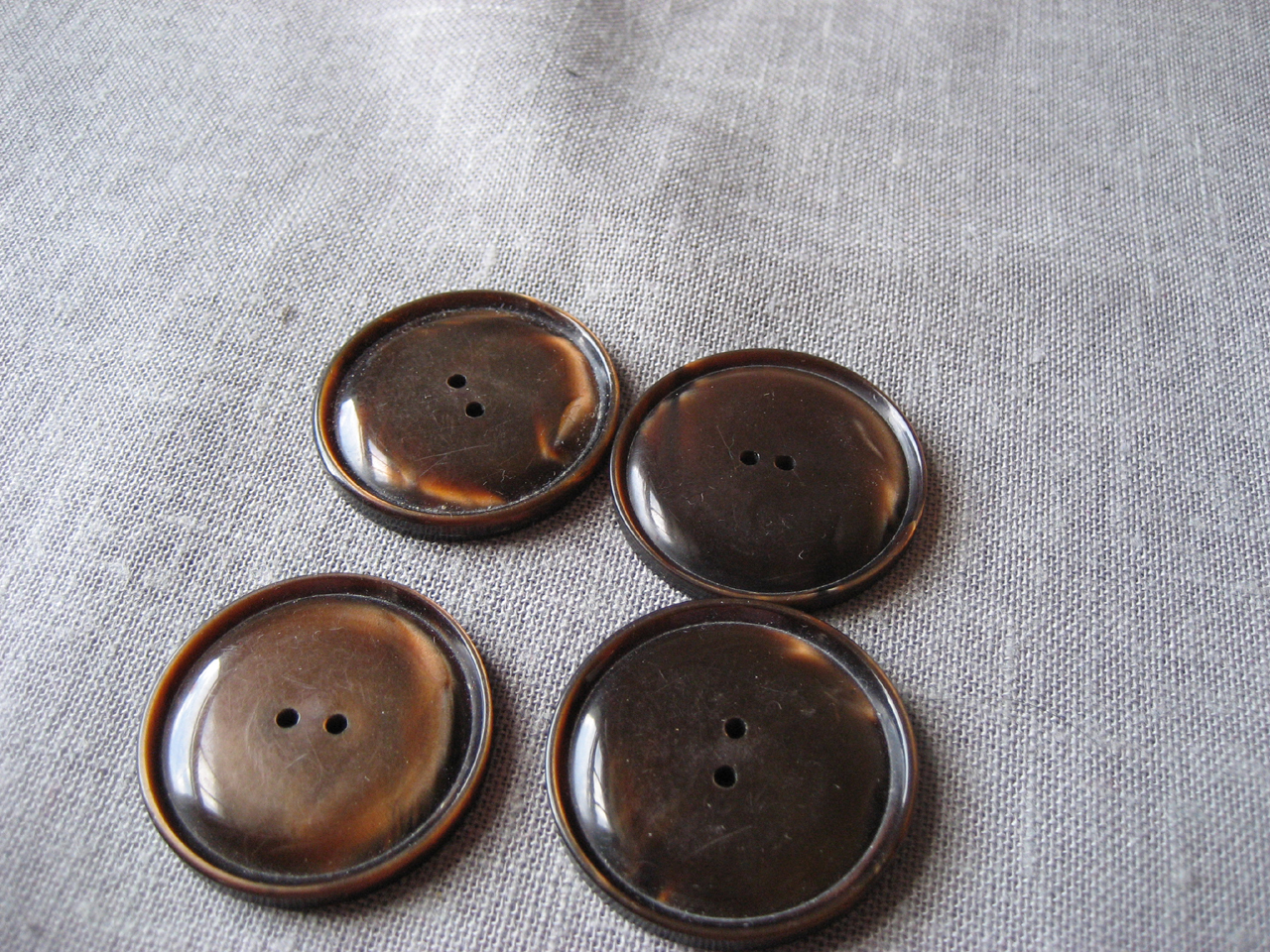 Four Plastic Brown Buttons