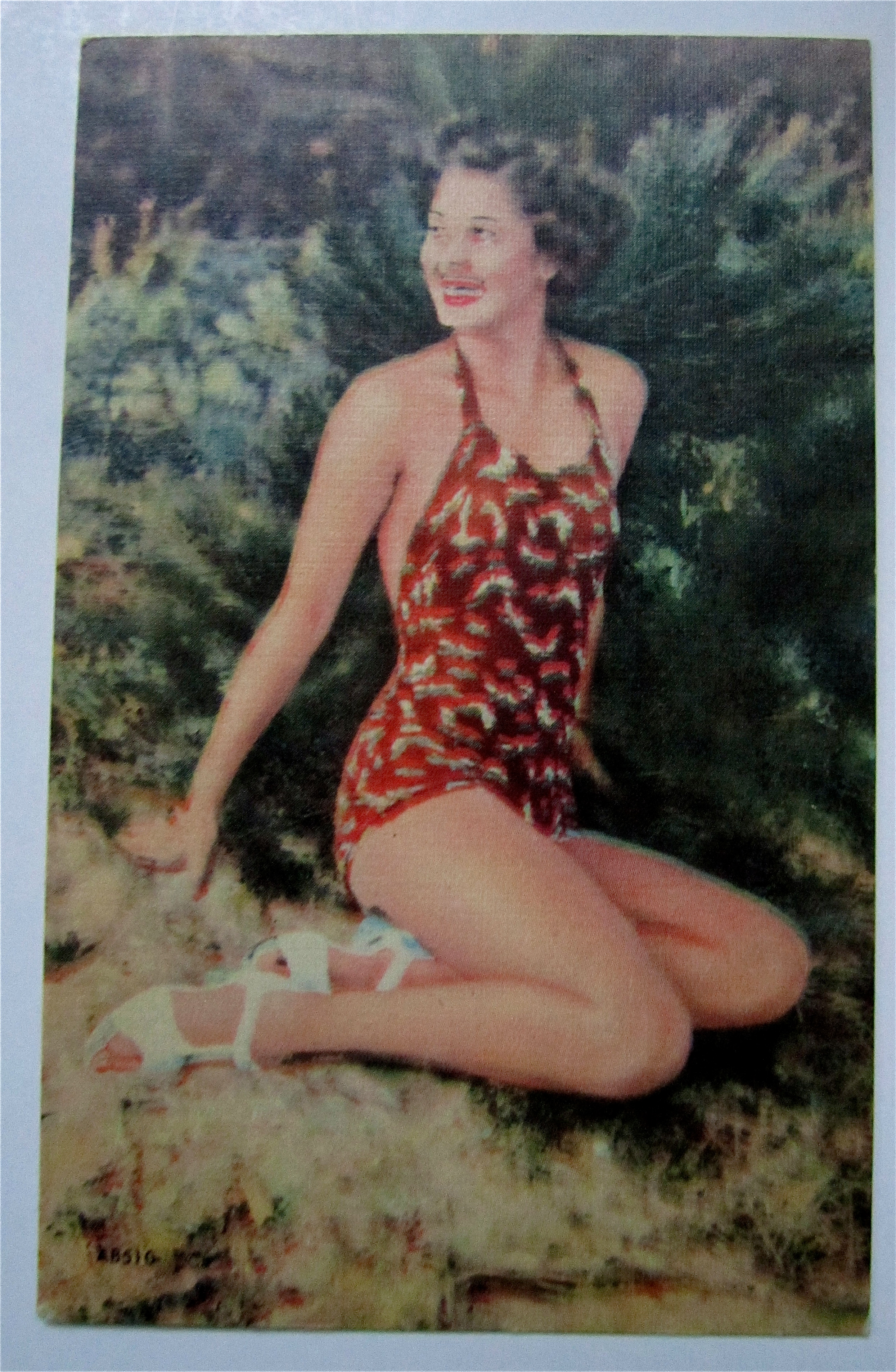 Woman Sitting On Sand Smiling Postcard