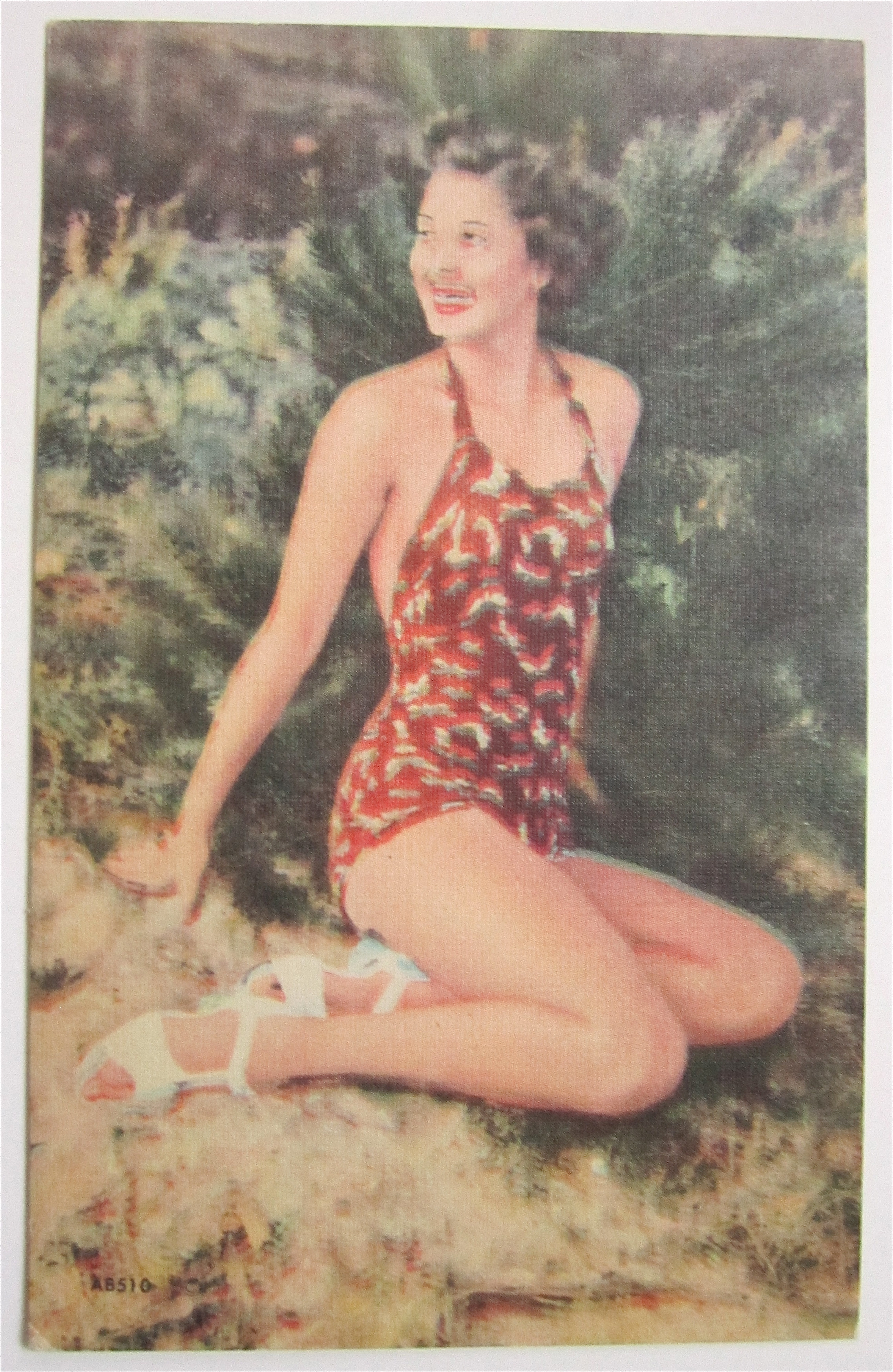 Woman Sitting On Sand Smiling Postcard