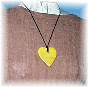 Bakelite Heart Pendant Gold 2 1/4 inches