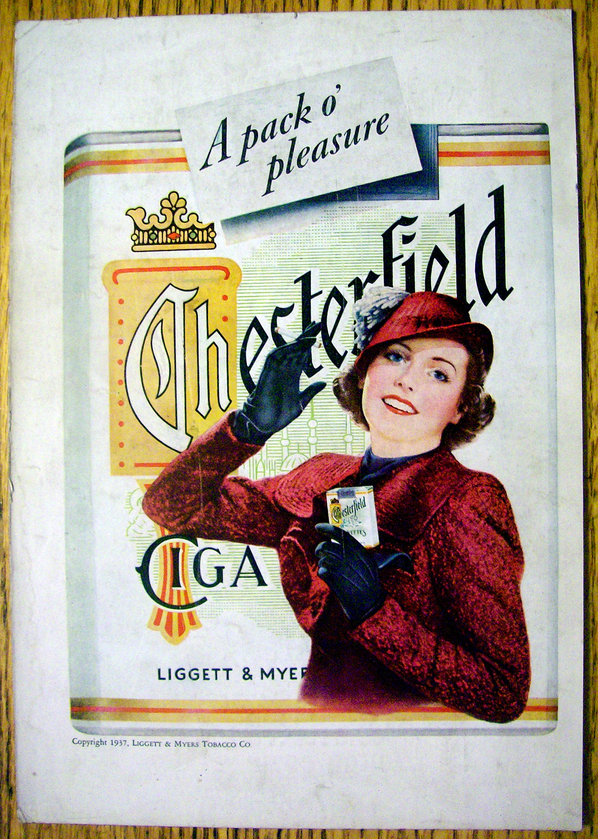 1937 Chesterfield Cigarettes w/Woman Holding Cigarettes