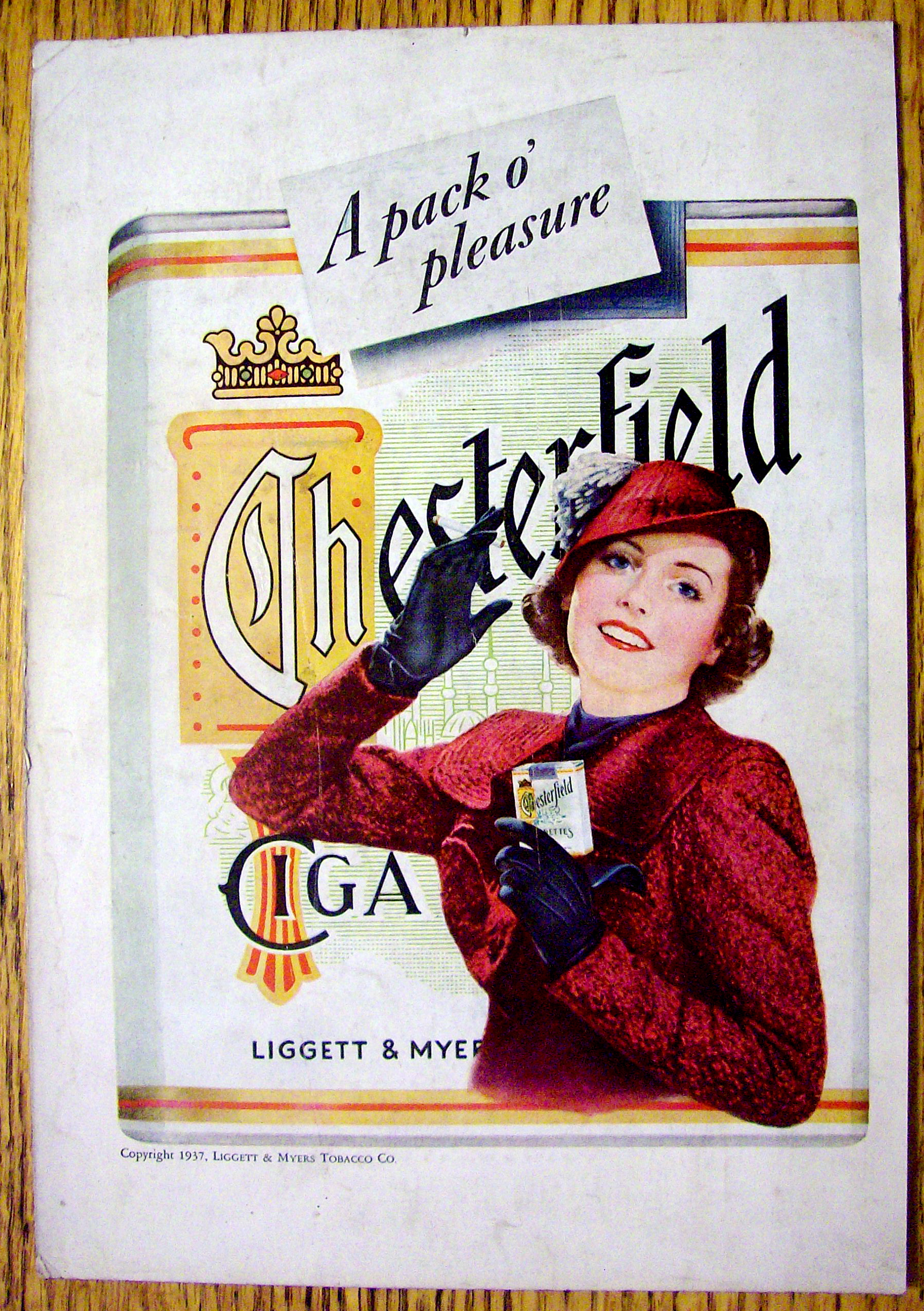 1937 Chesterfield Cigarettes w/Woman Holding Cigarettes