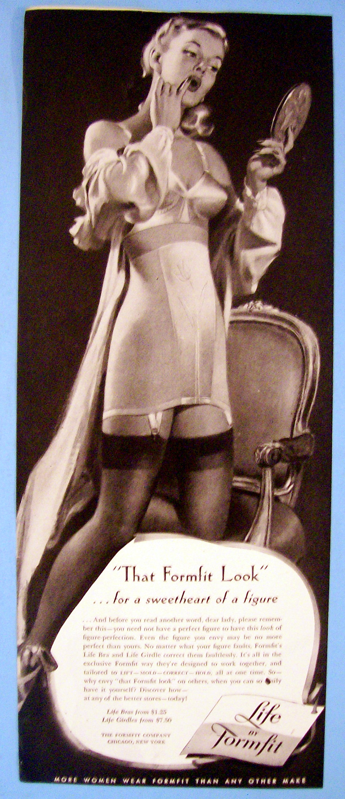 1949 Formfit Look with Woman Looking in Mirror
