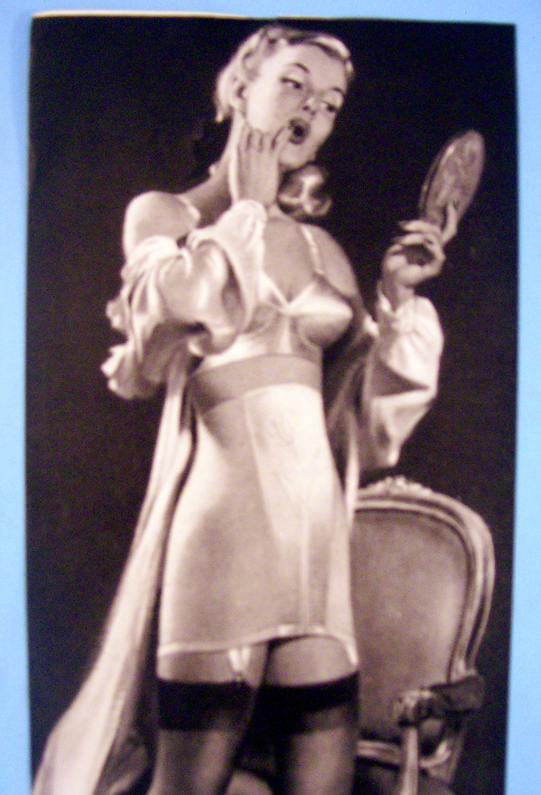 1949 Formfit Look with Woman Looking in Mirror