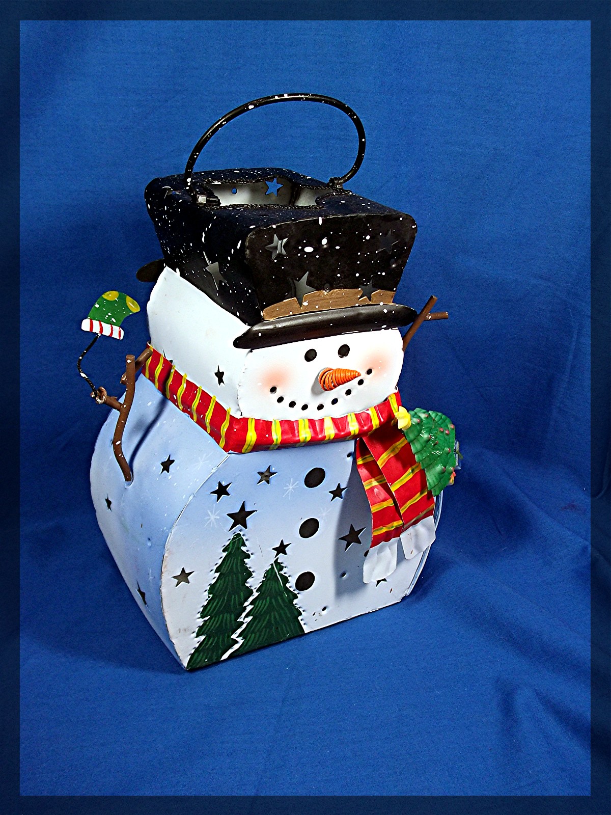 Snowman Luminary, Metal with glitter. Holds a tea light