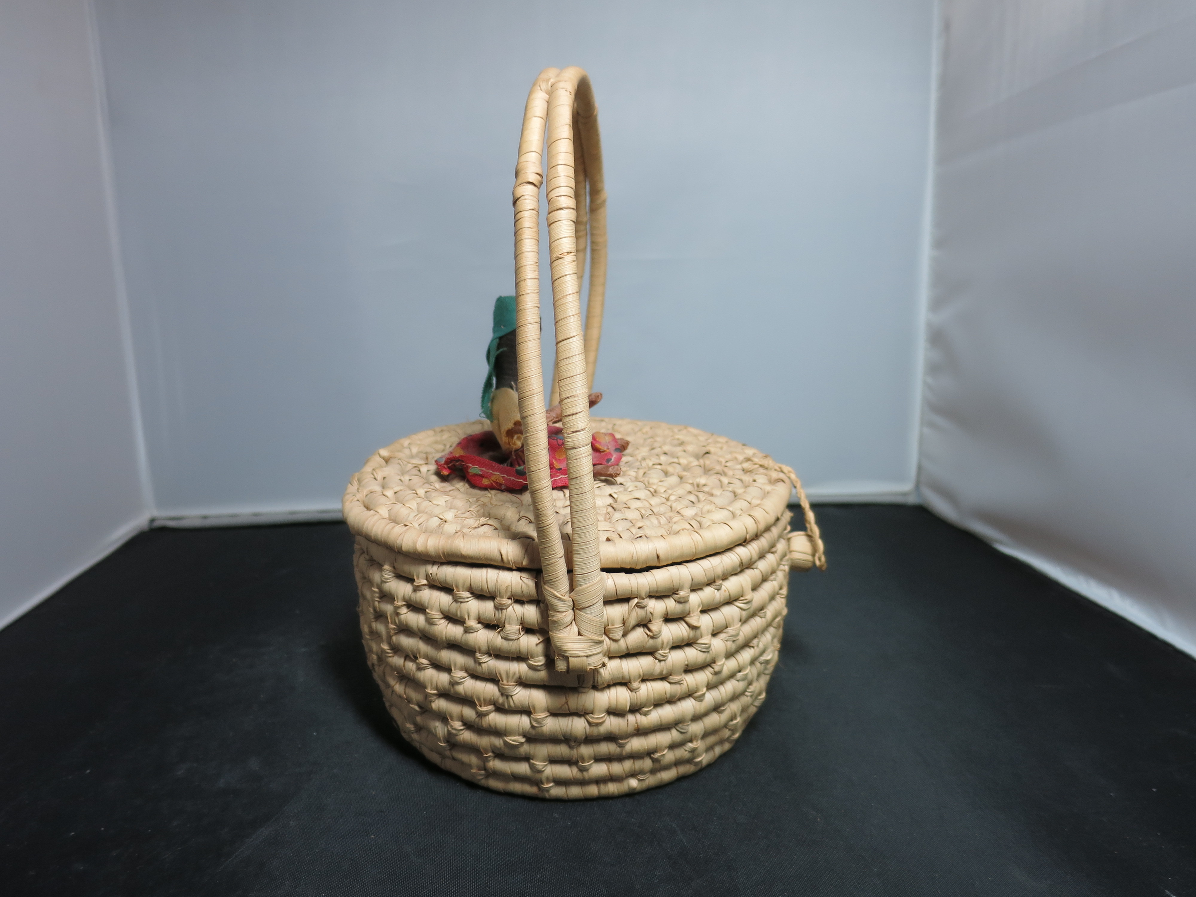 Coiled Basket with Lid and Handle Black African Doll on top