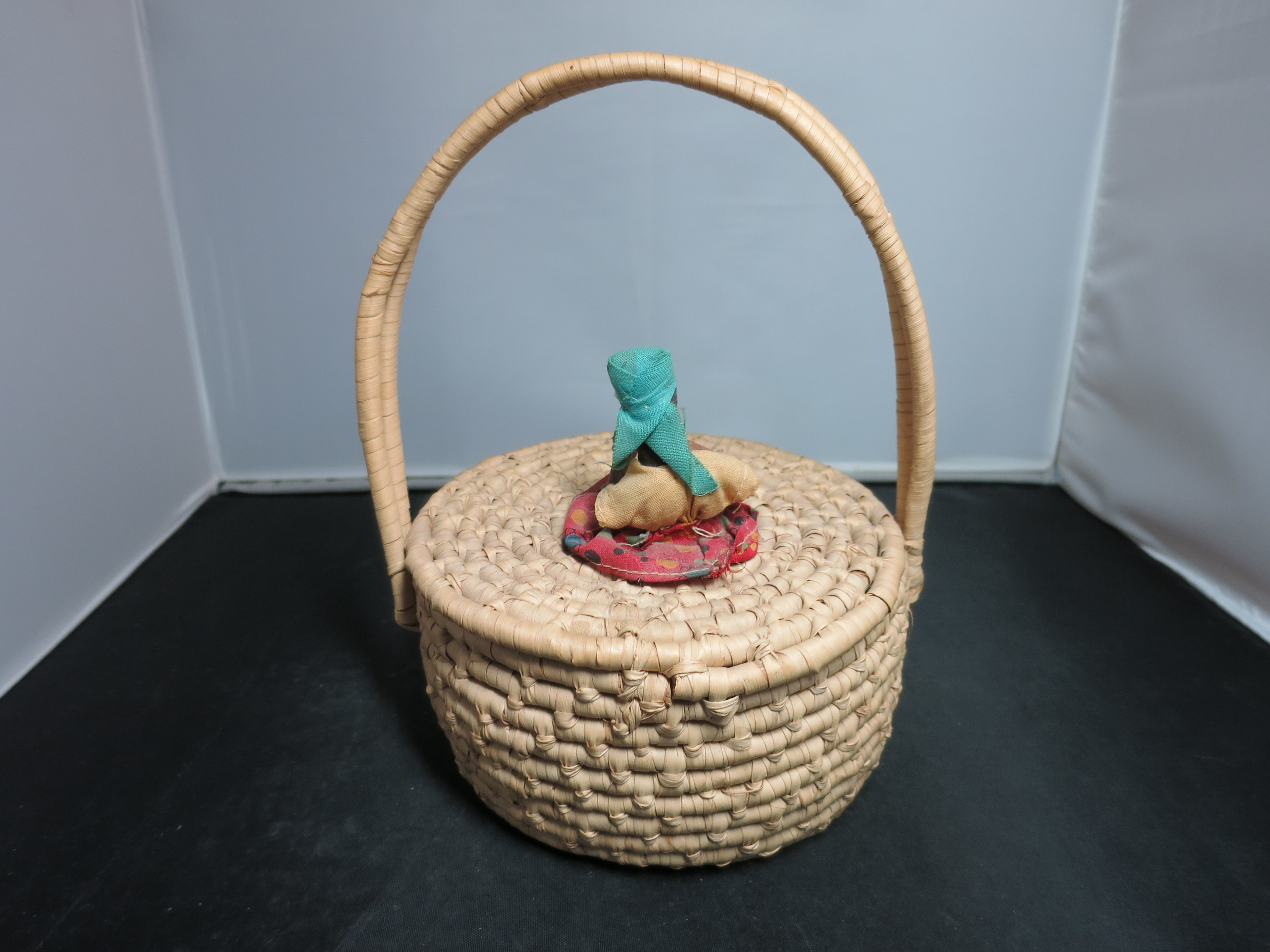Coiled Basket with Lid and Handle Black African Doll on top