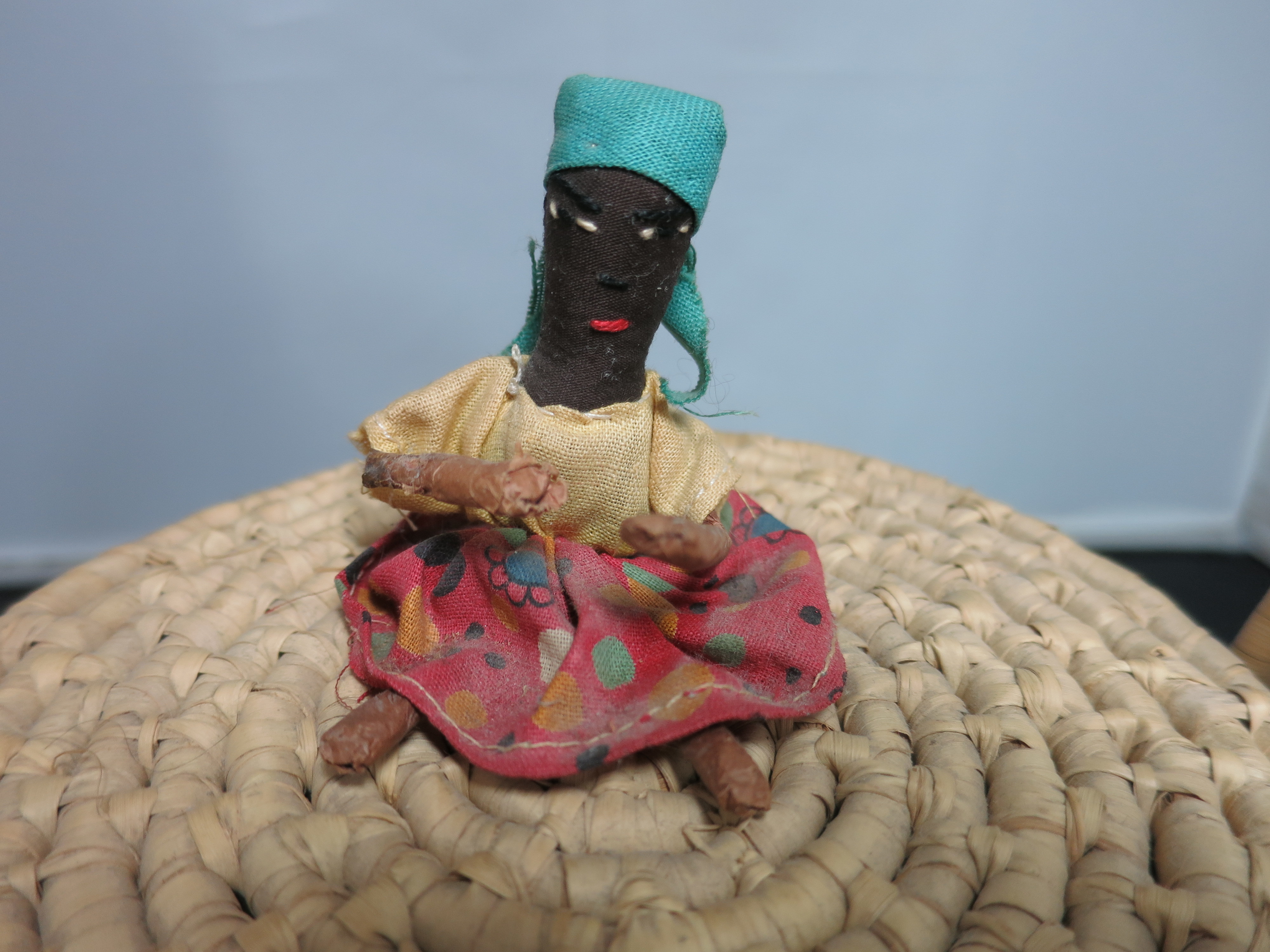 Coiled Basket with Lid and Handle Black African Doll on top
