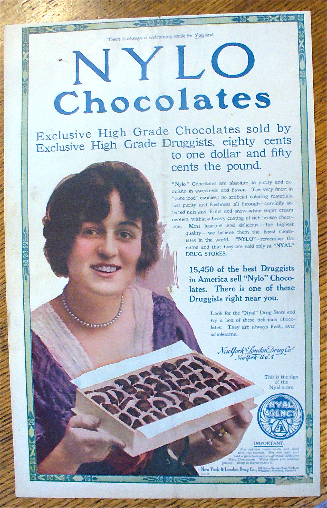 1913 Nylo Chocolates with Woman Holding Box Of Candy